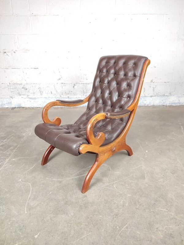 Brown Chesterfield armchair