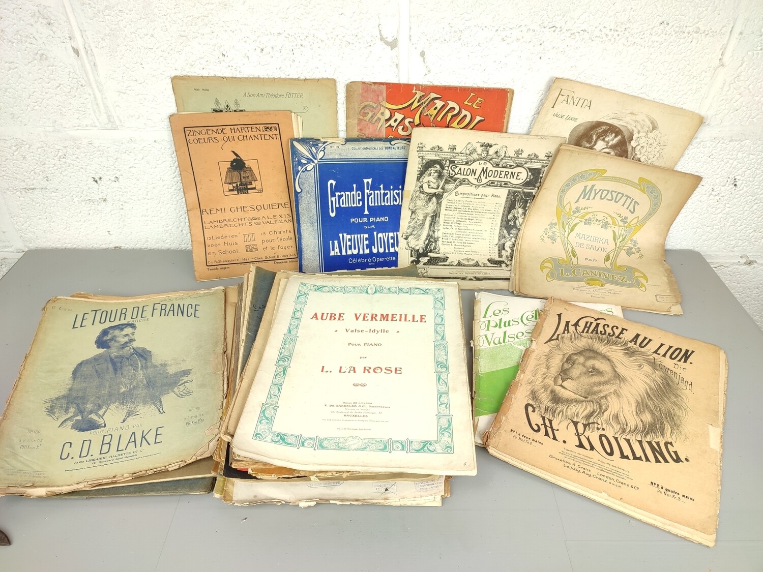 Large pile of piano sheet music