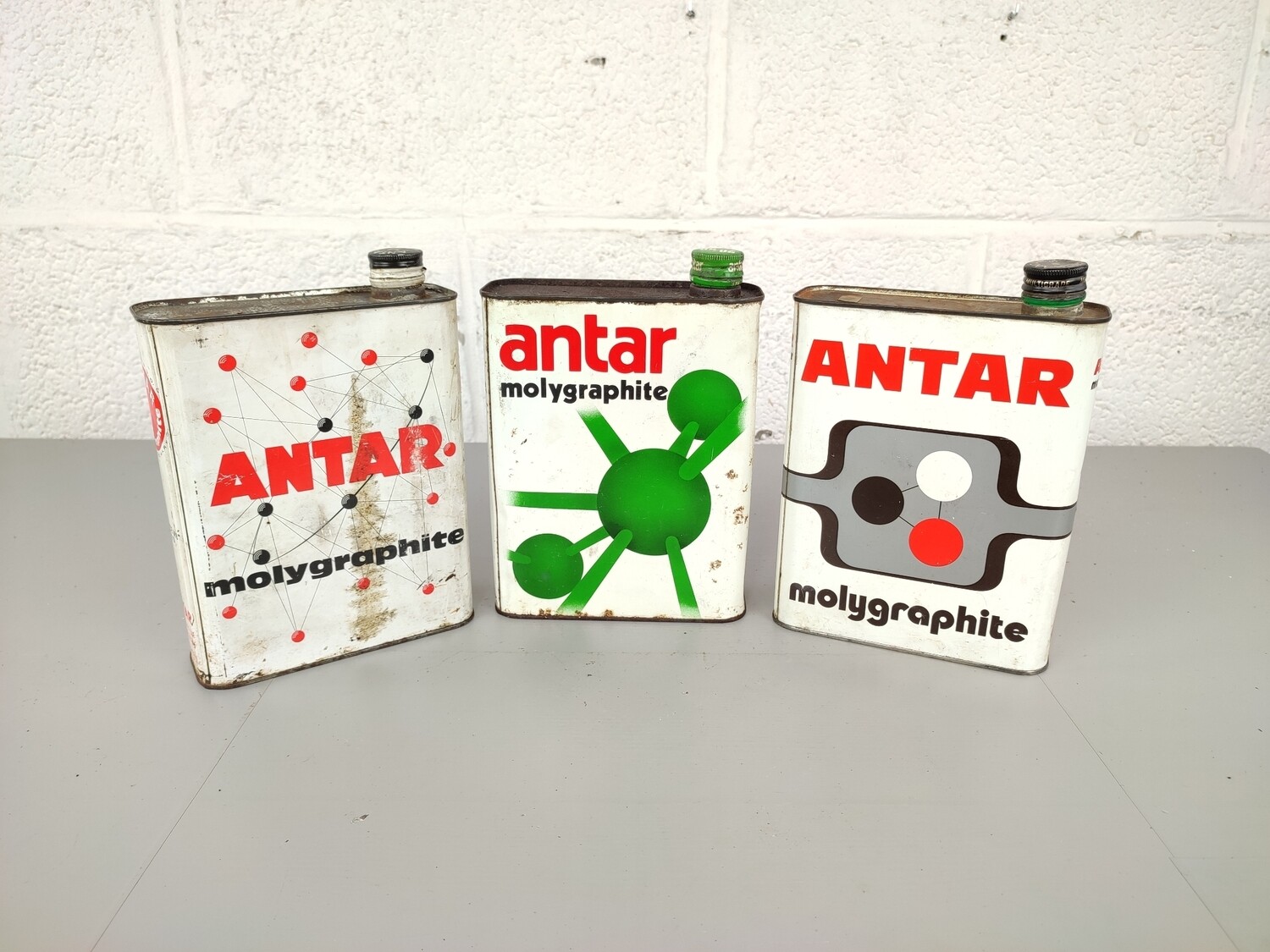 3 old oil cans Antar