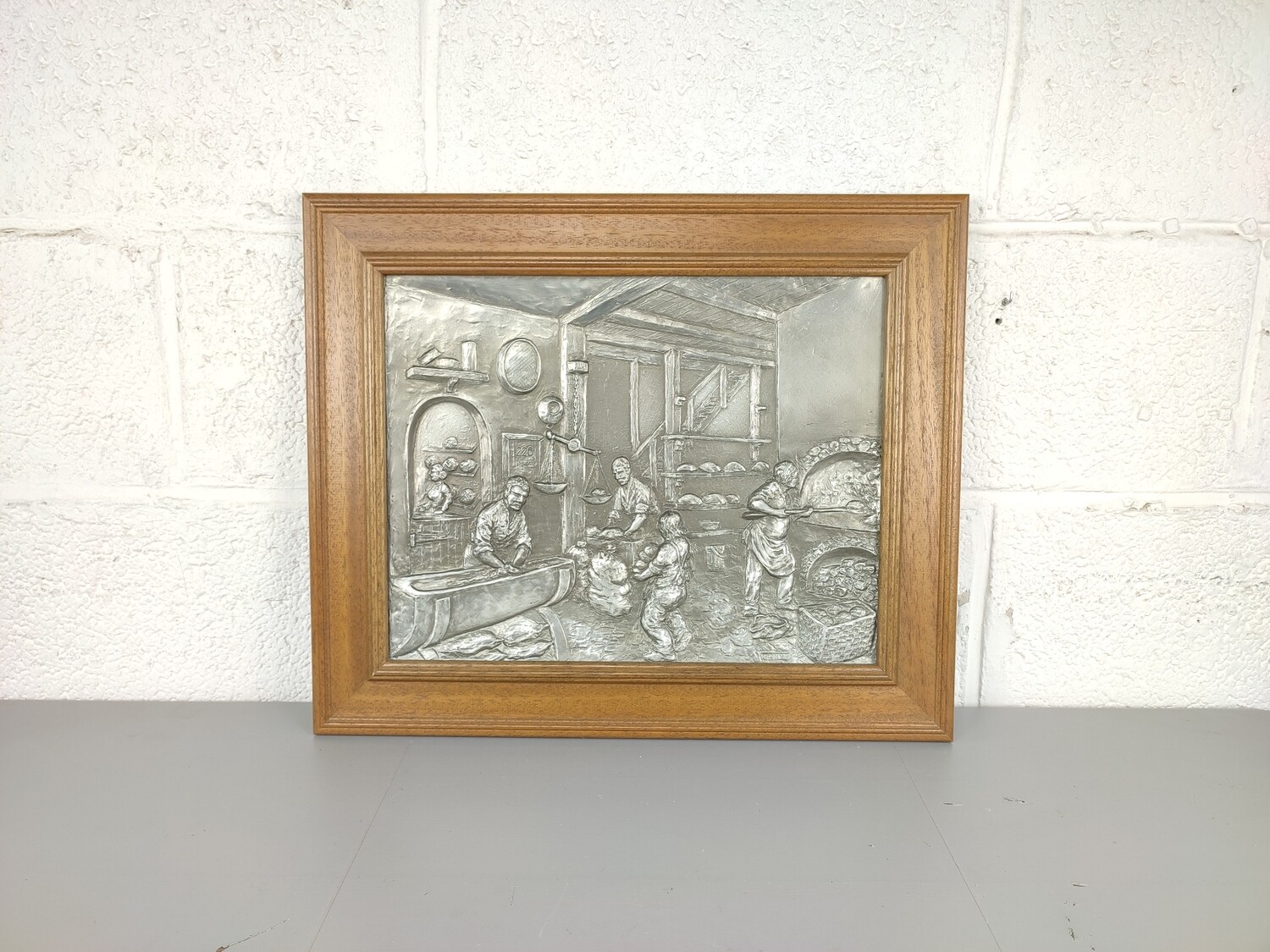 Pewter bakery wall plate