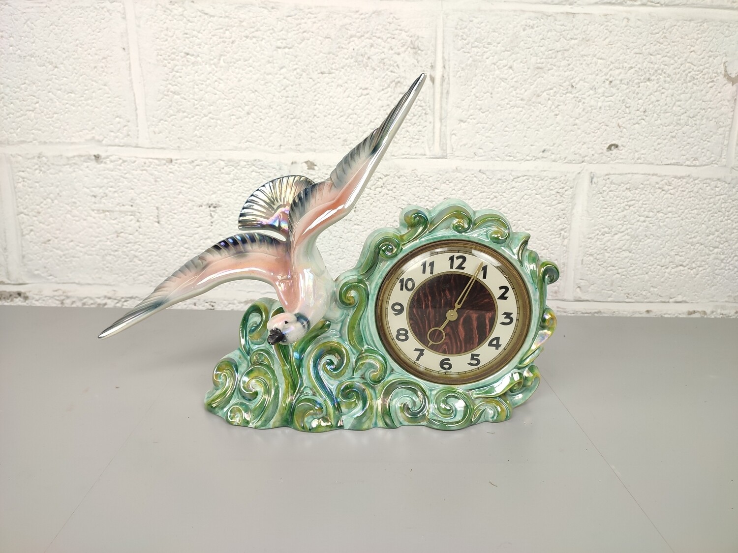 Porcelain clock with bird