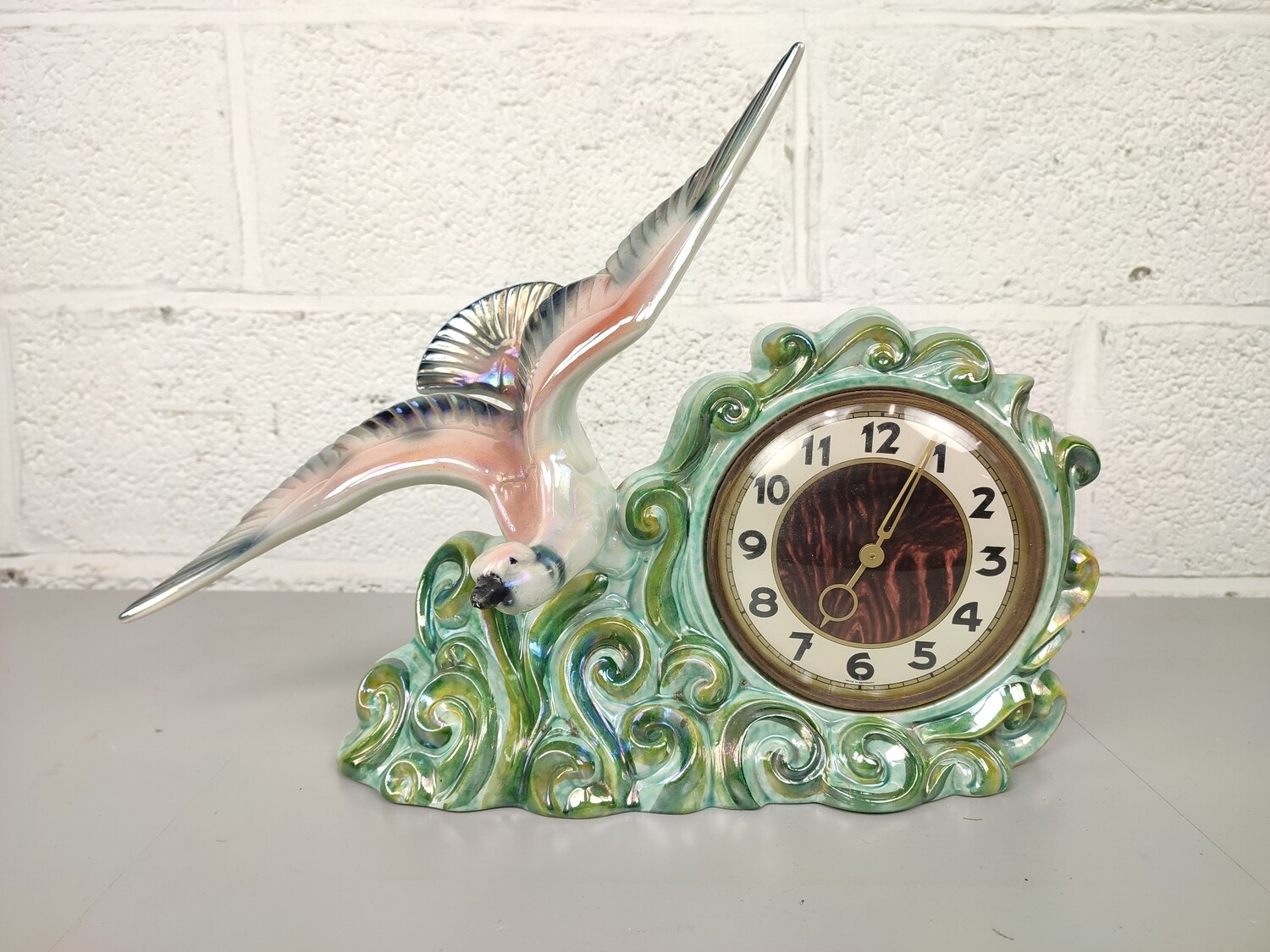 Porcelain clock with bird