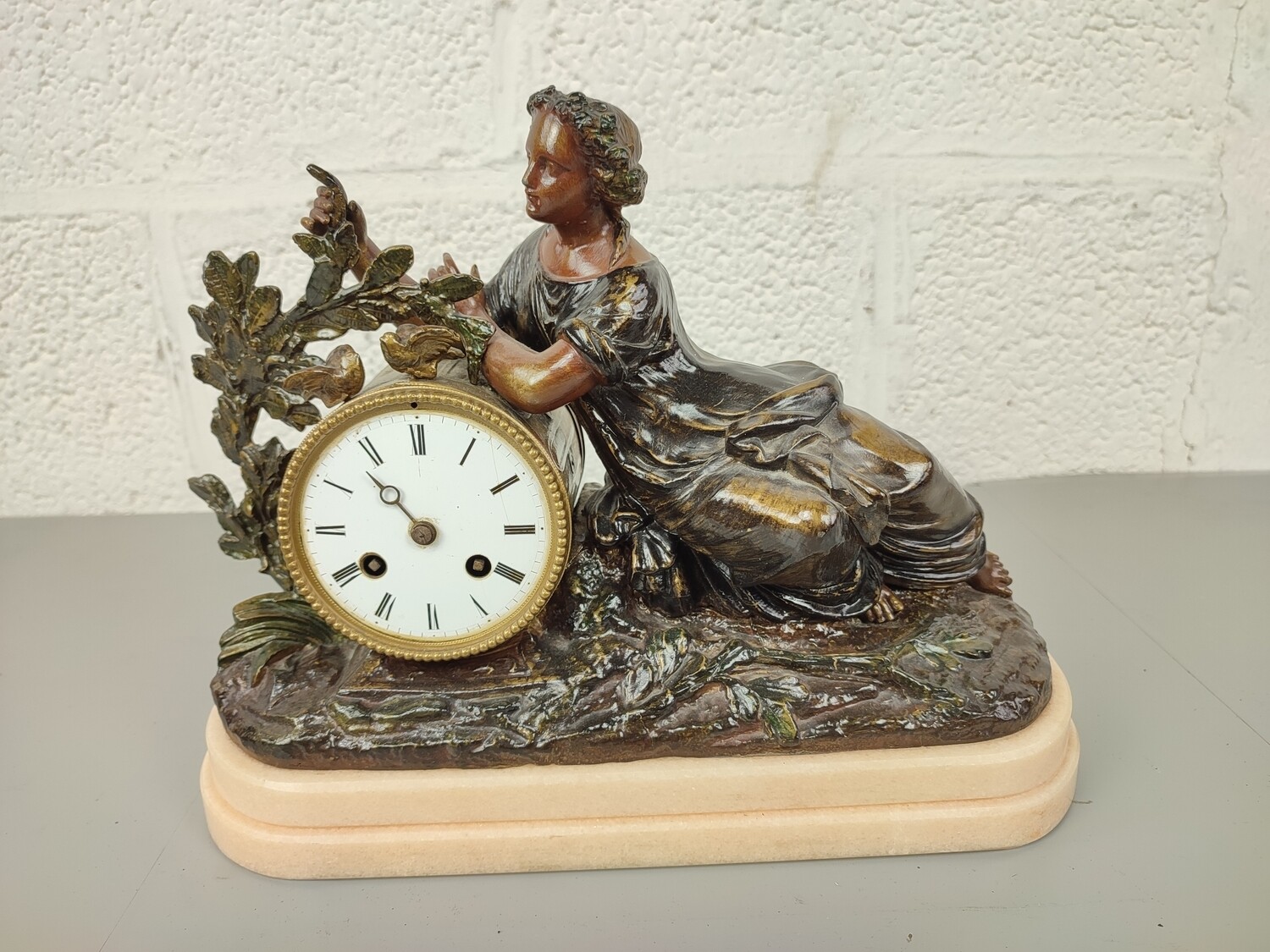 Antique clock with statue