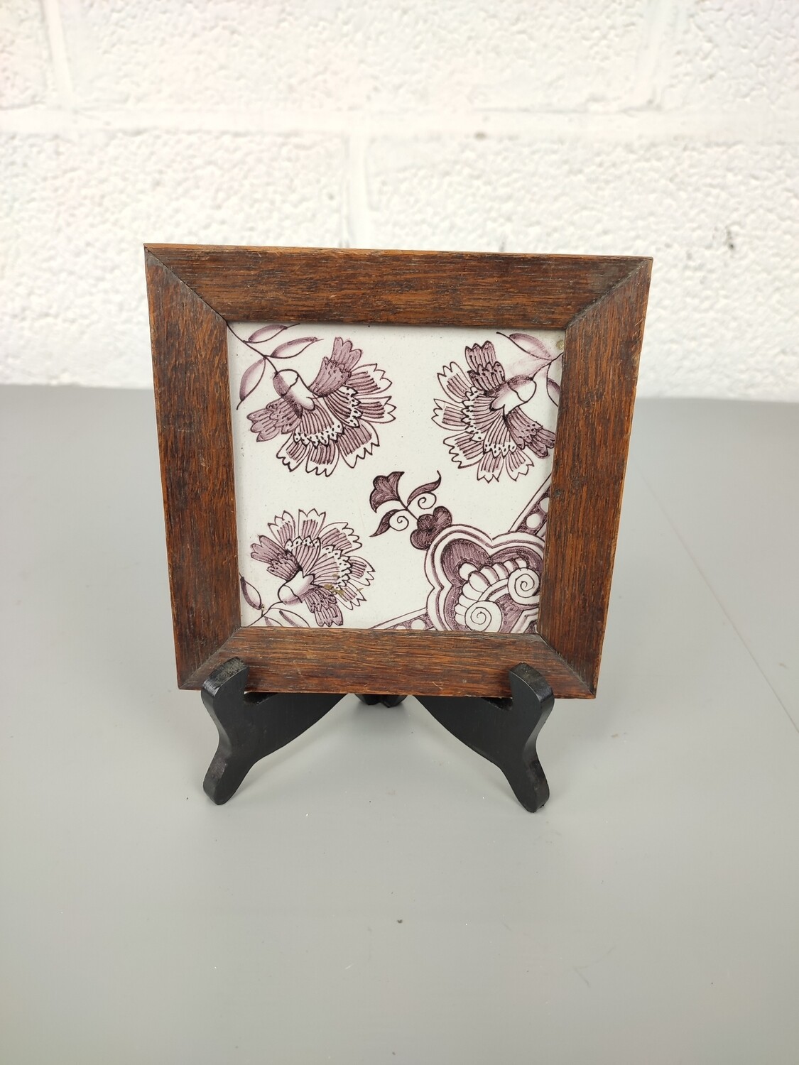 Antique tile in frame