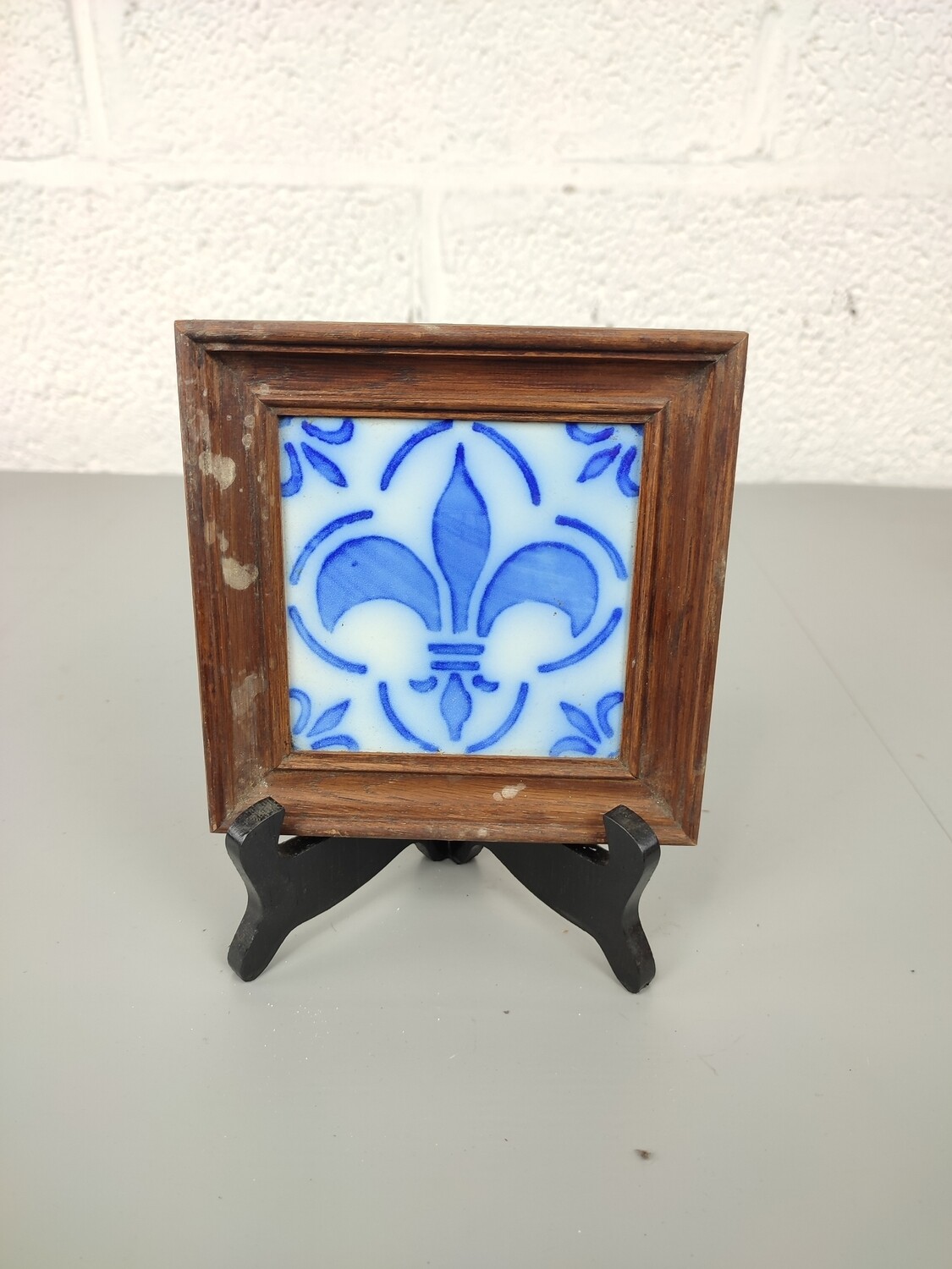 Antique tile in frame