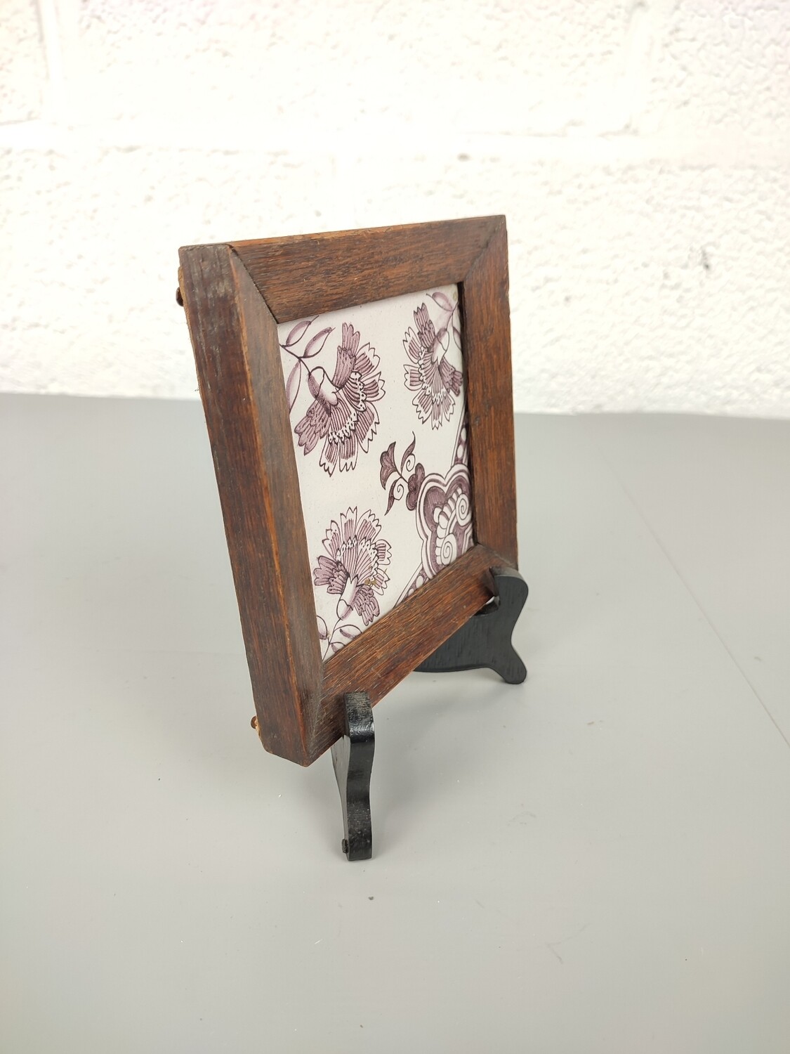 Antique tile in frame