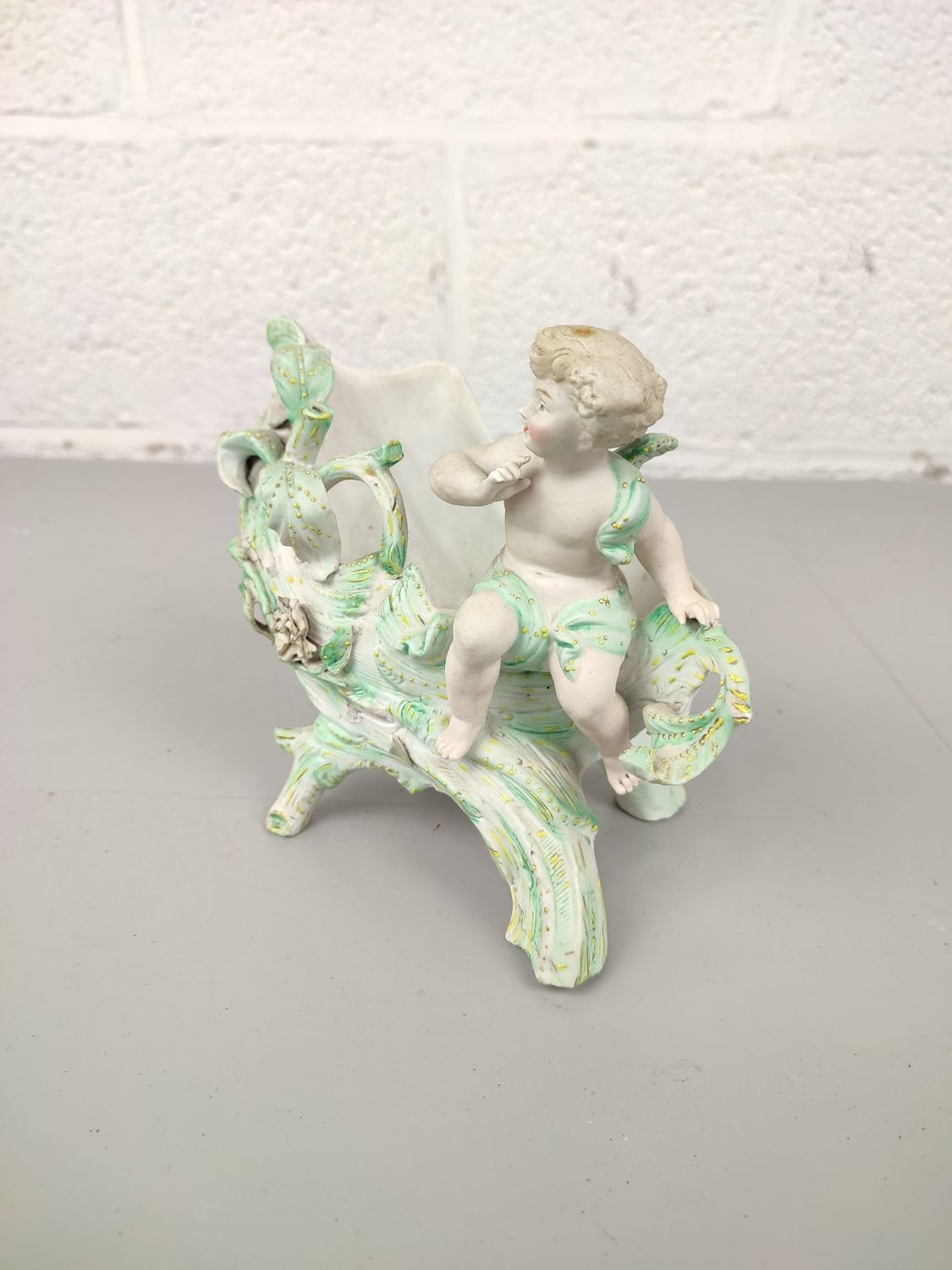 Vintage flowerpot with angel