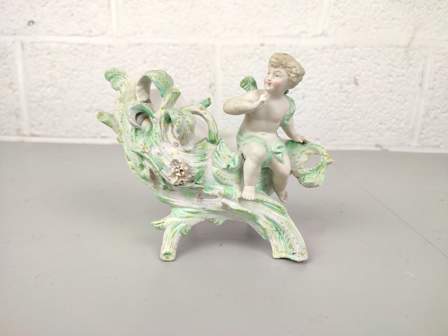 Vintage flowerpot with angel