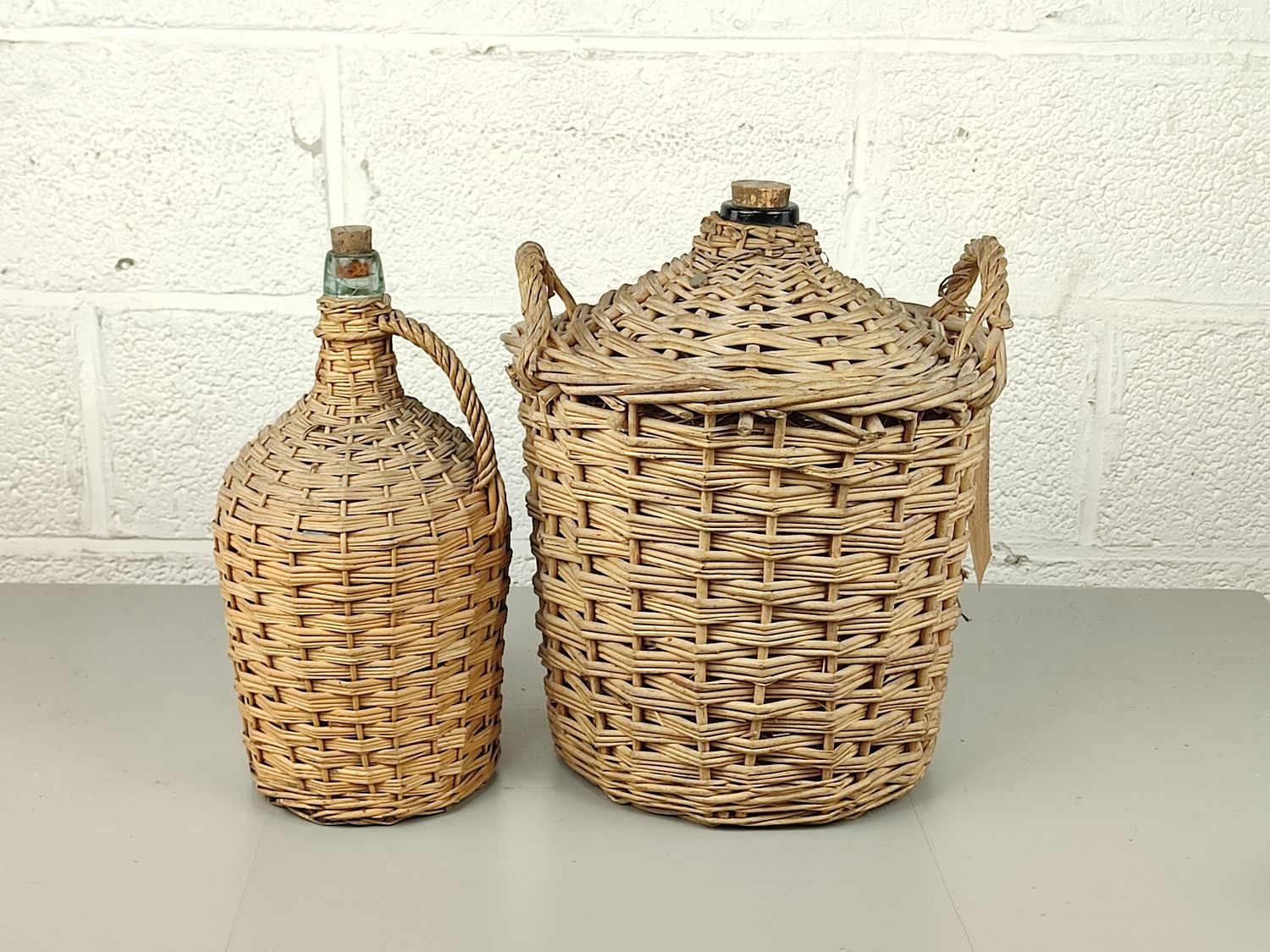 2 old glass alcohol bottles