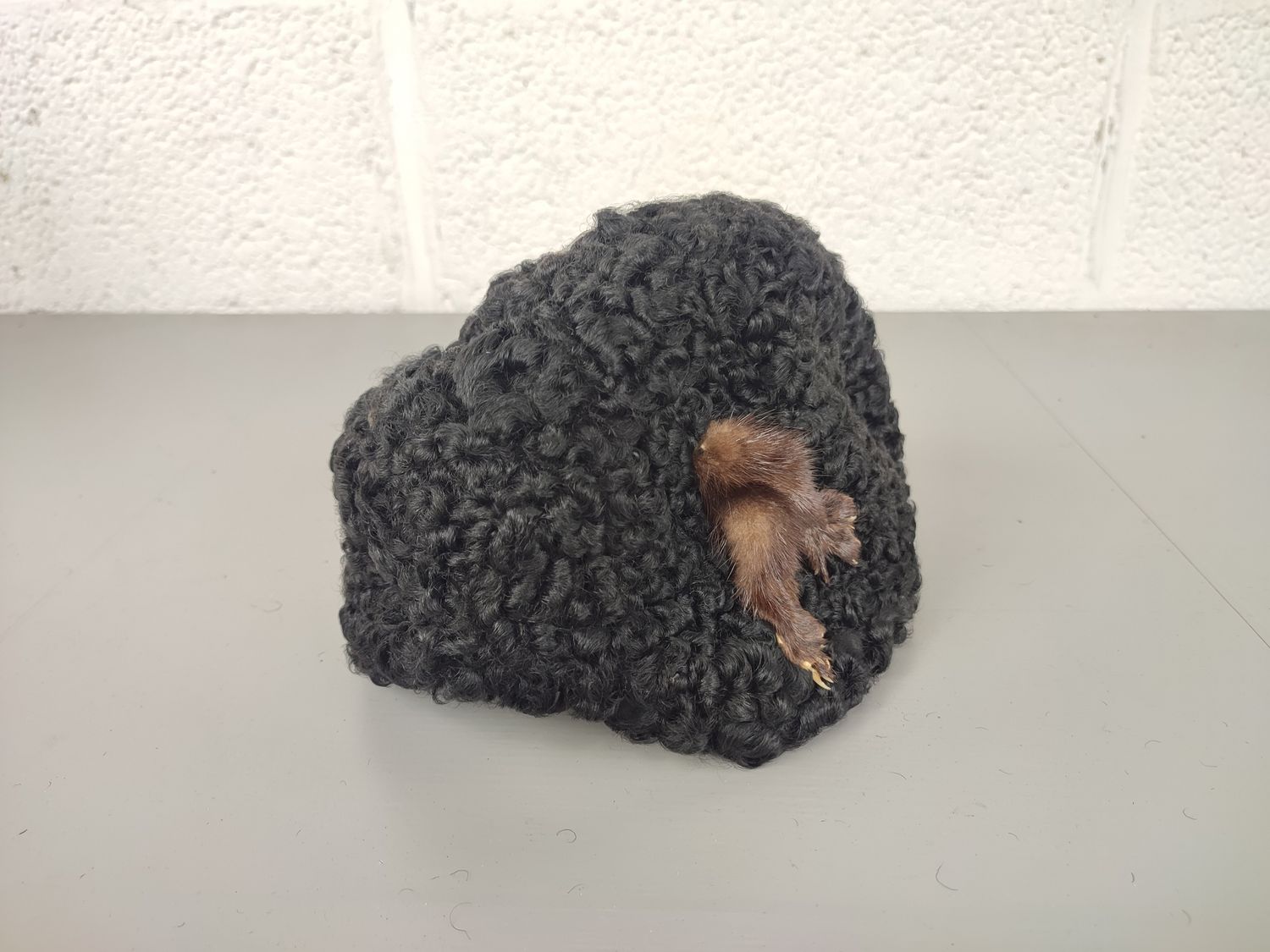 Black hat with mink legs