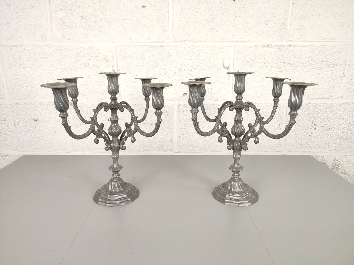 Pair of pewter candelabras