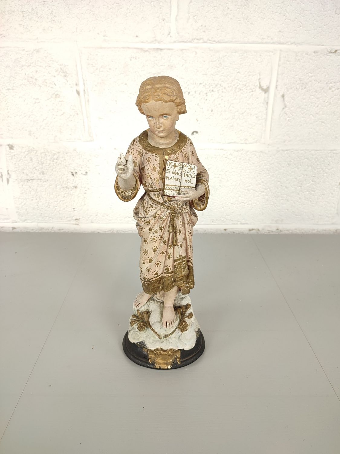 Plaster statue Jesus with book