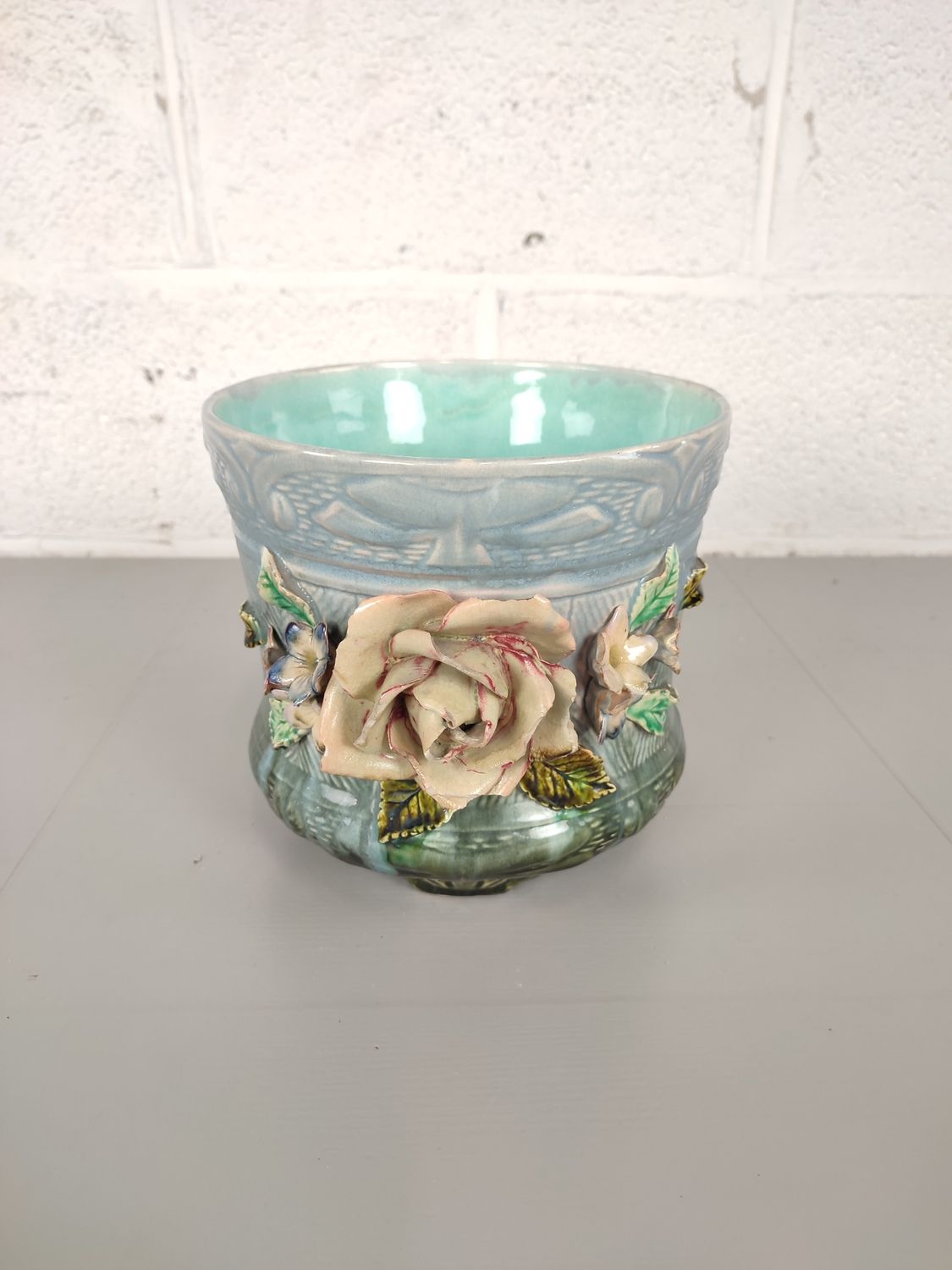 Vintage flowerpot with flower decor