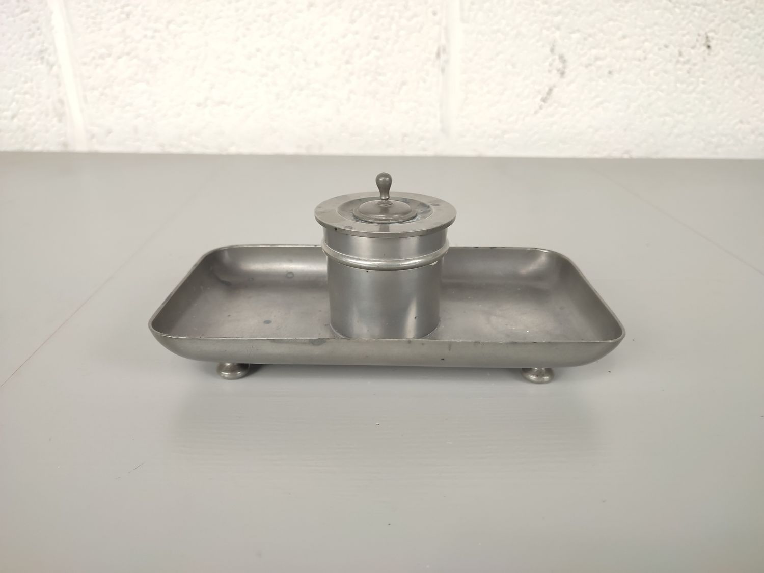 Old inkwell in metal