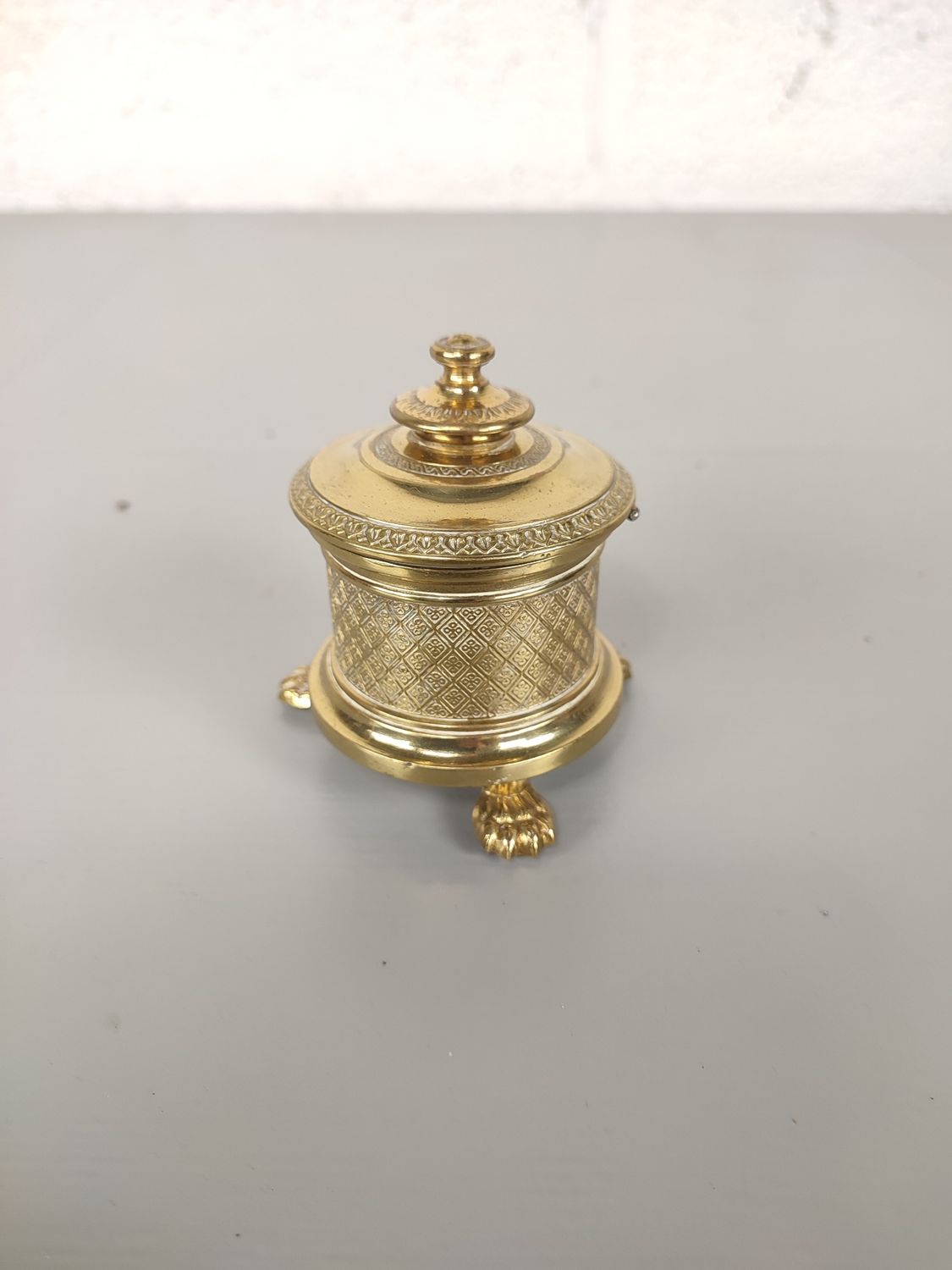 Antique brass inkwell