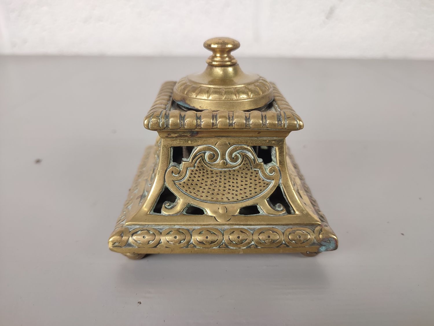 Antique brass inkwell