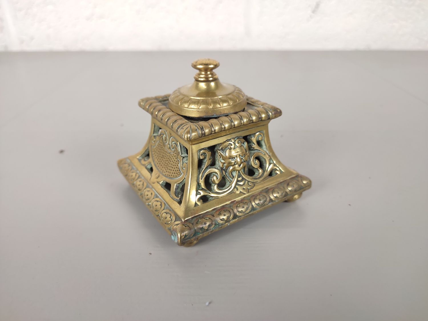 Antique brass inkwell