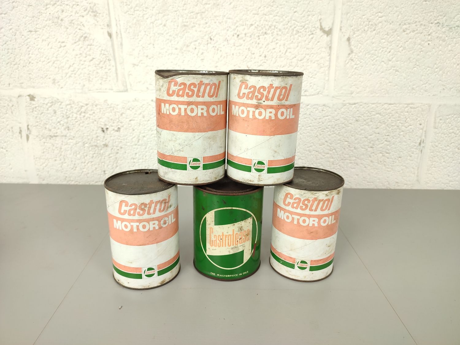 5 old Castrol oil cans