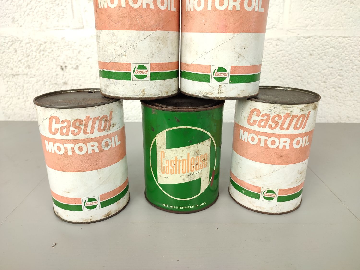 5 old Castrol oil cans
