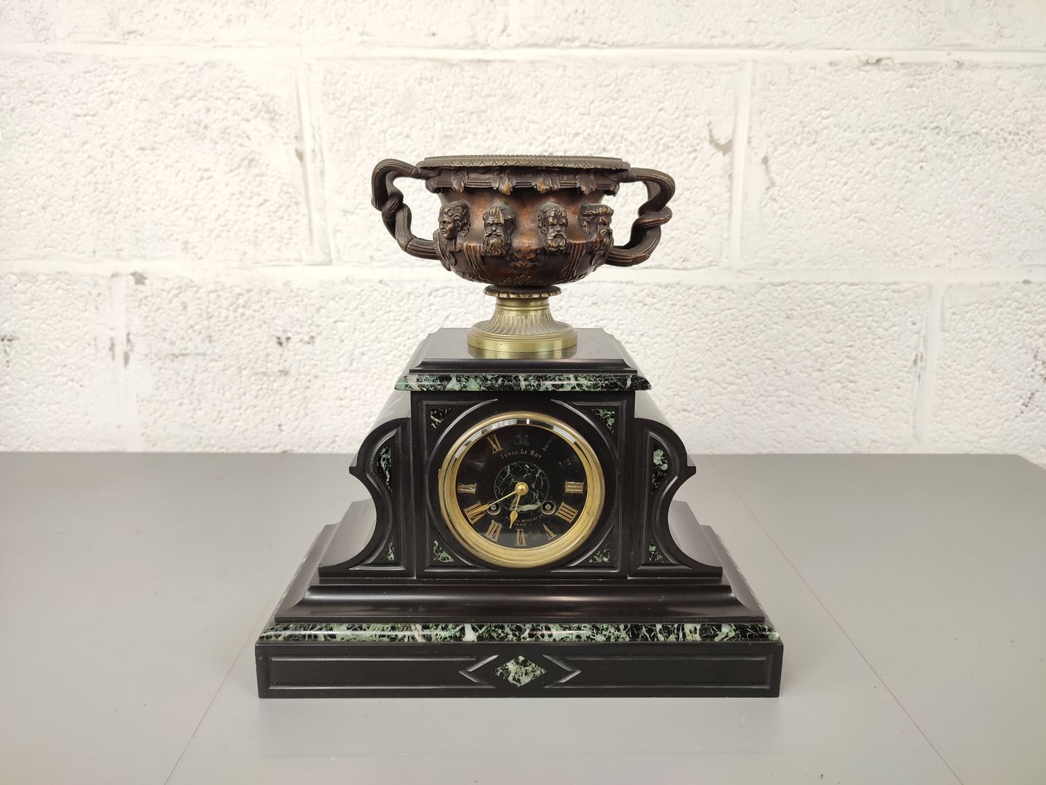 Antique marble clock with bronze coupe
