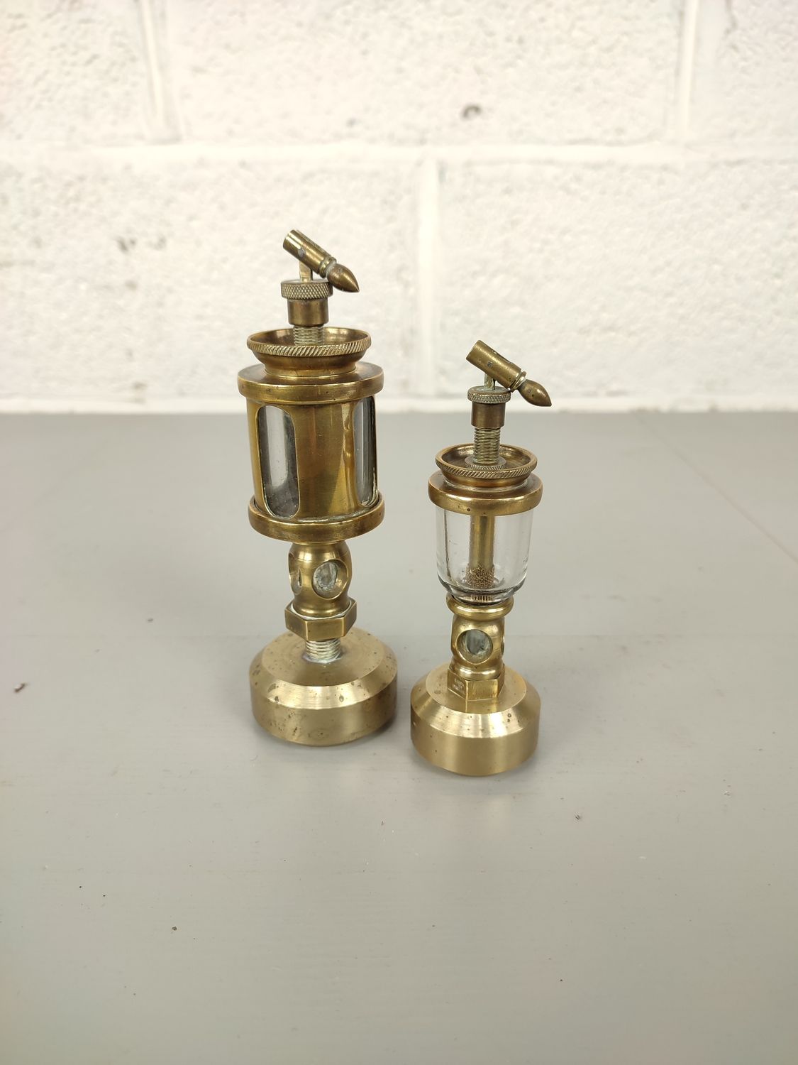 2 antique brass oilers
