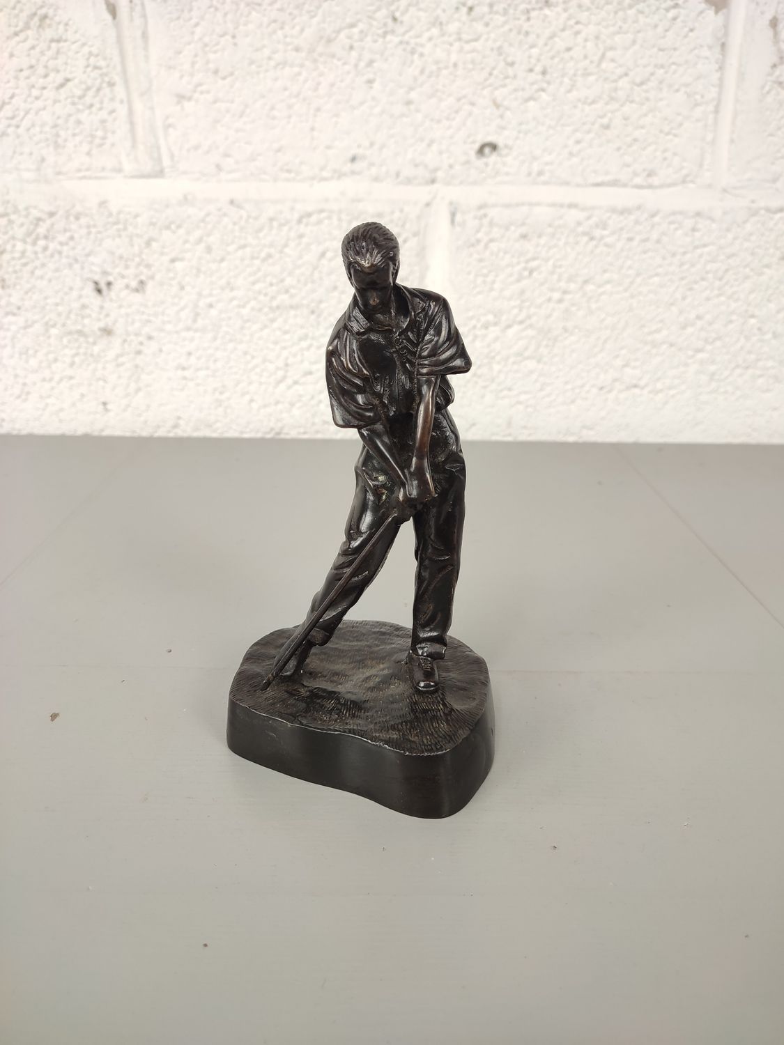 Bronze statue of a golfer