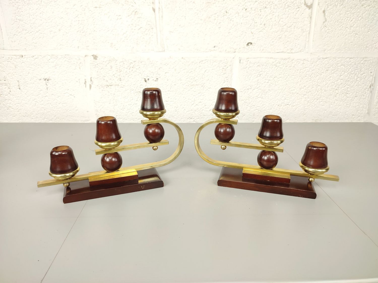 Pair of art deco candlesticks in brass &amp; wood.