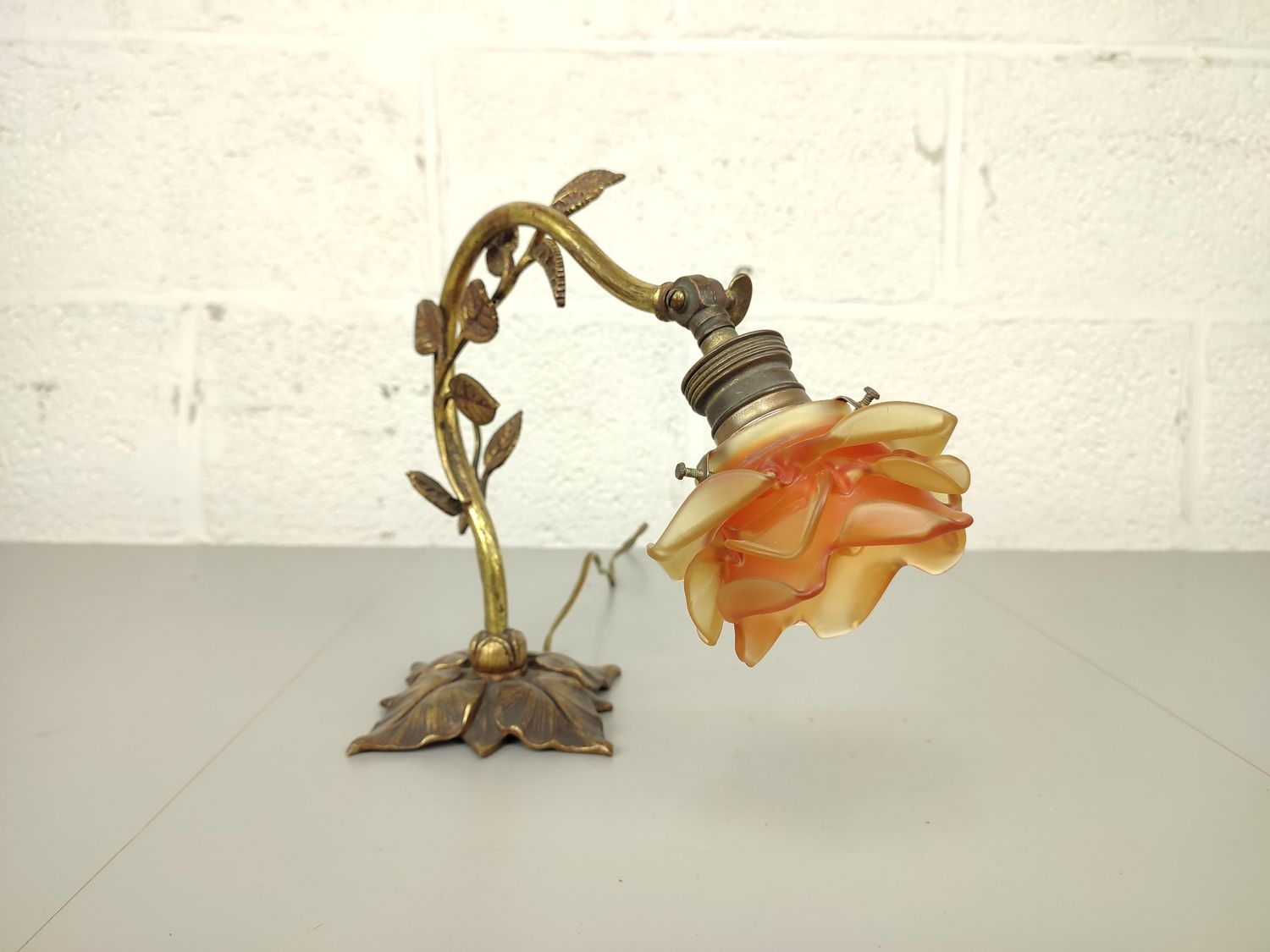 Antique bronze lamp with glass flower