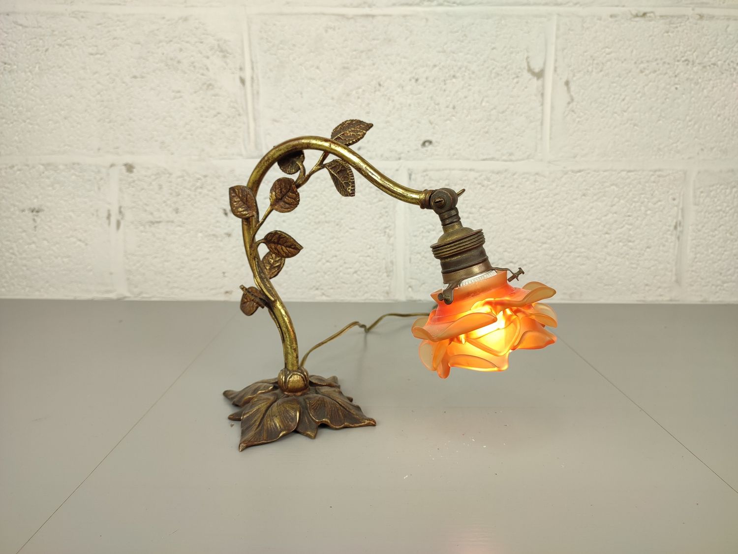 Antique bronze lamp with glass flower
