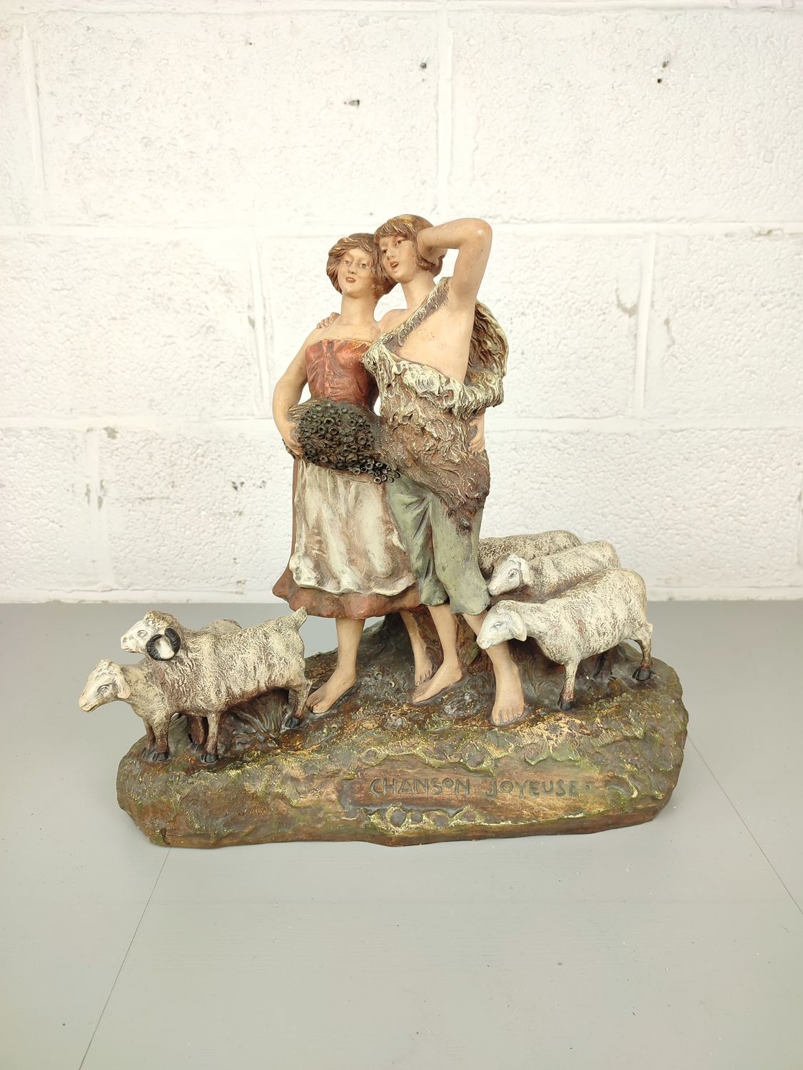 Large antique statue with sheep