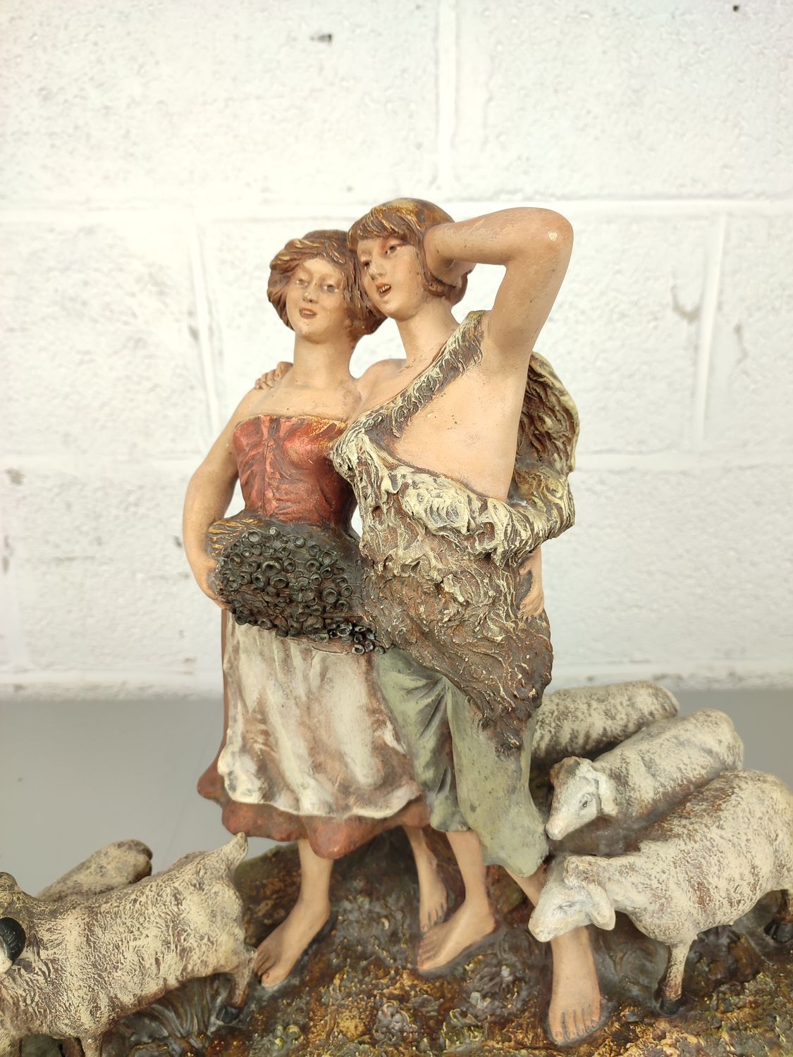 Large antique statue with sheep