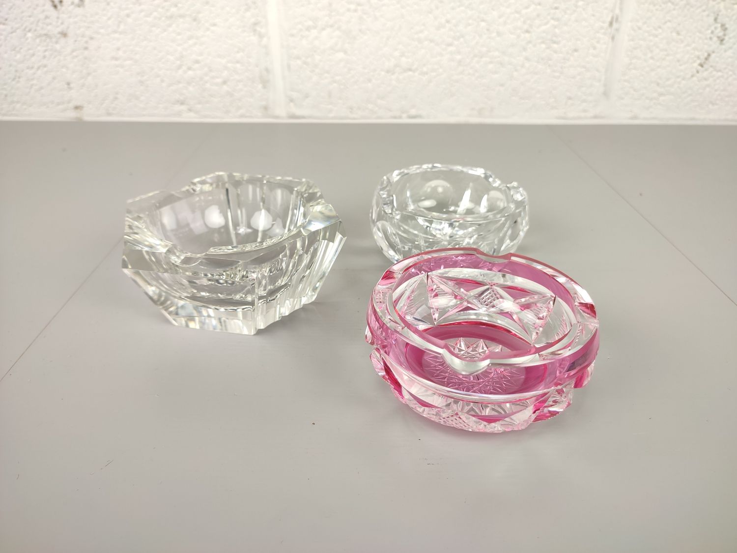 3 crystal ashtrays with chip
