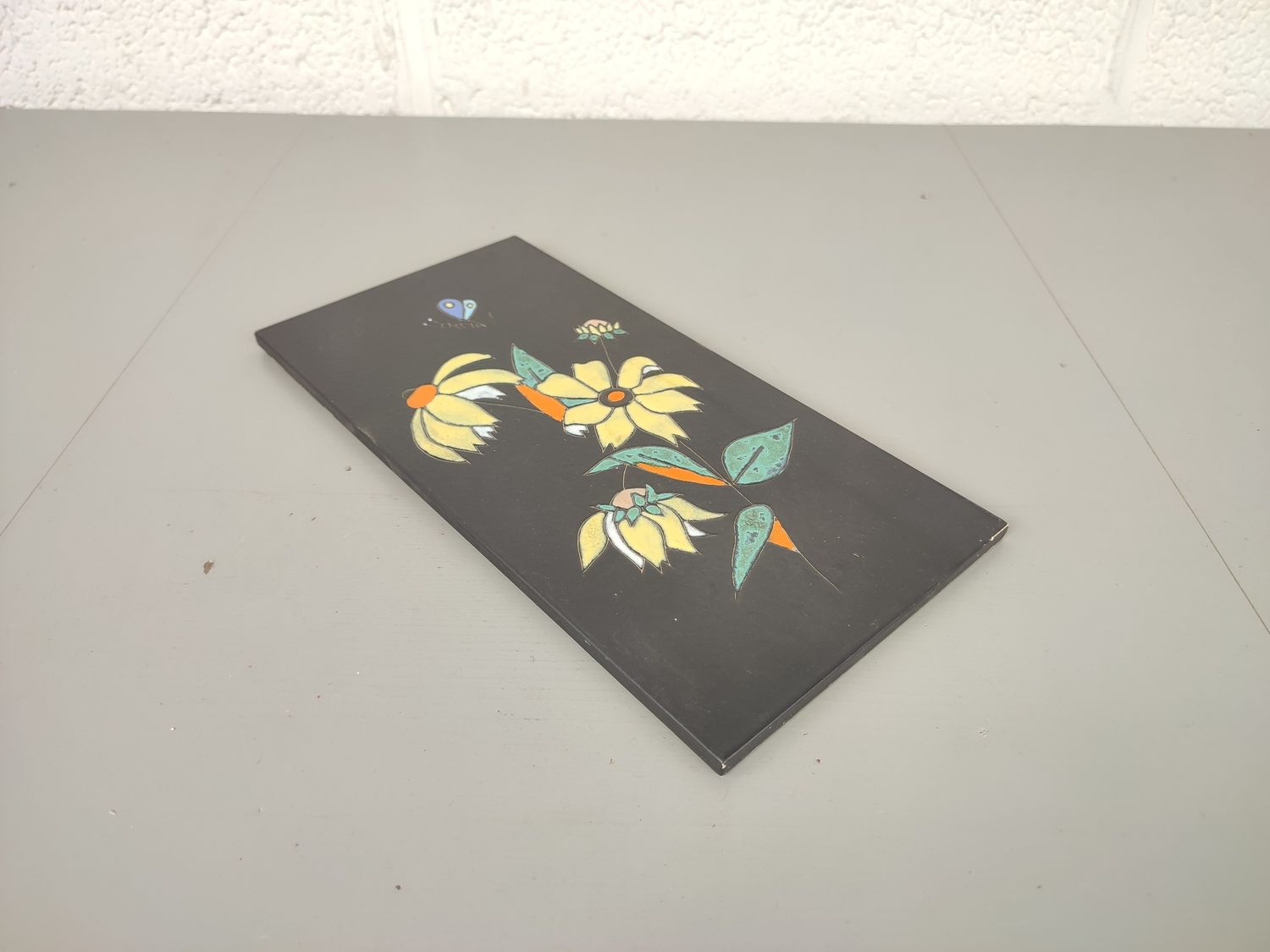 Vintage ceramic wall tile Servais
