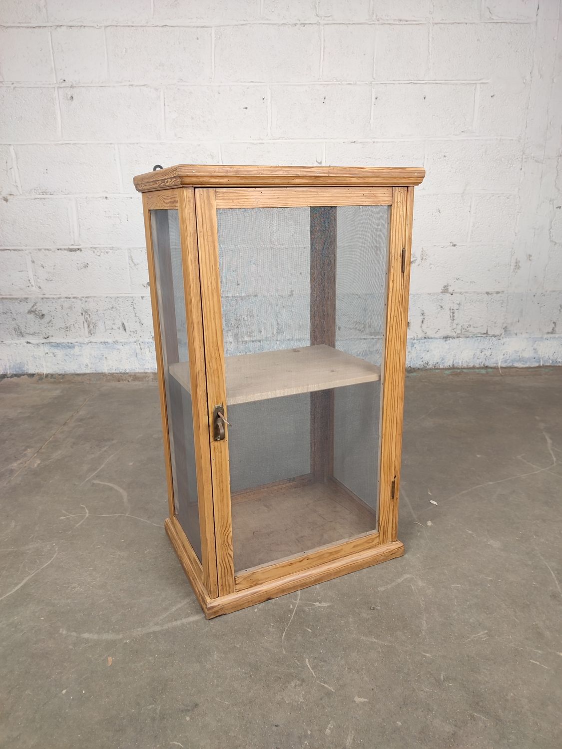 Old wooden cheese cabinet with mesh