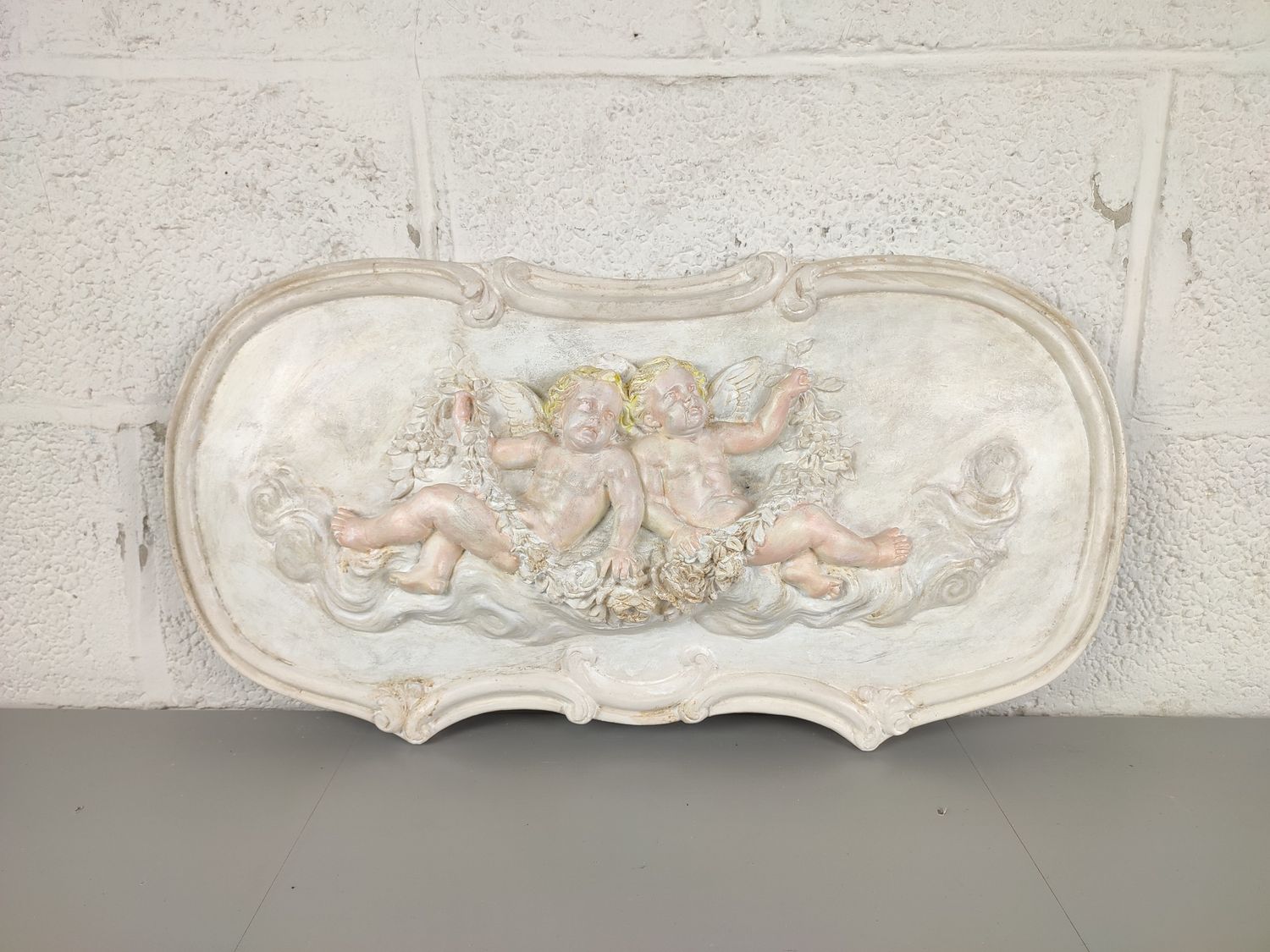 Large plaster bas-relief with cherubs