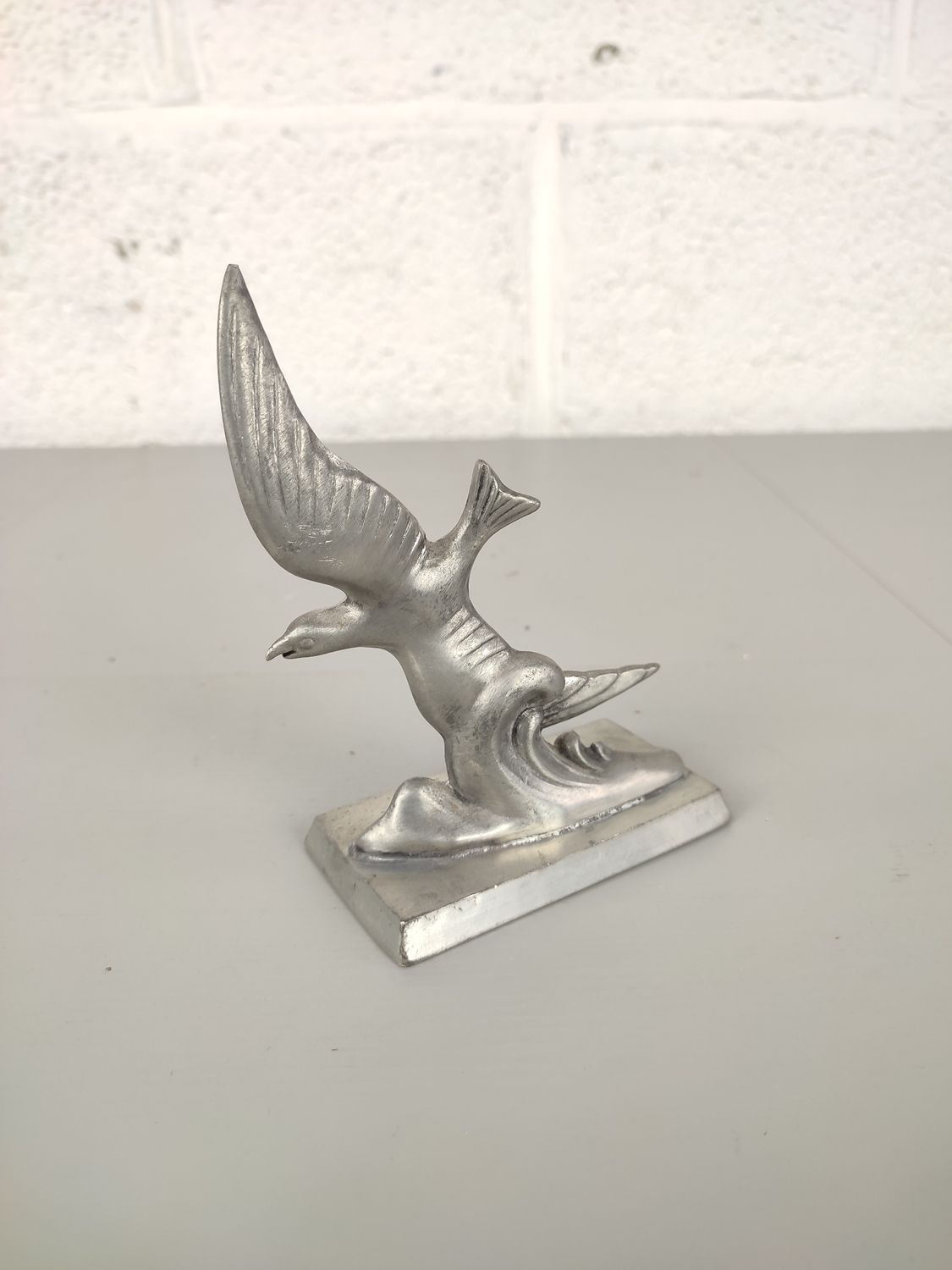Pewter figurine of a bird