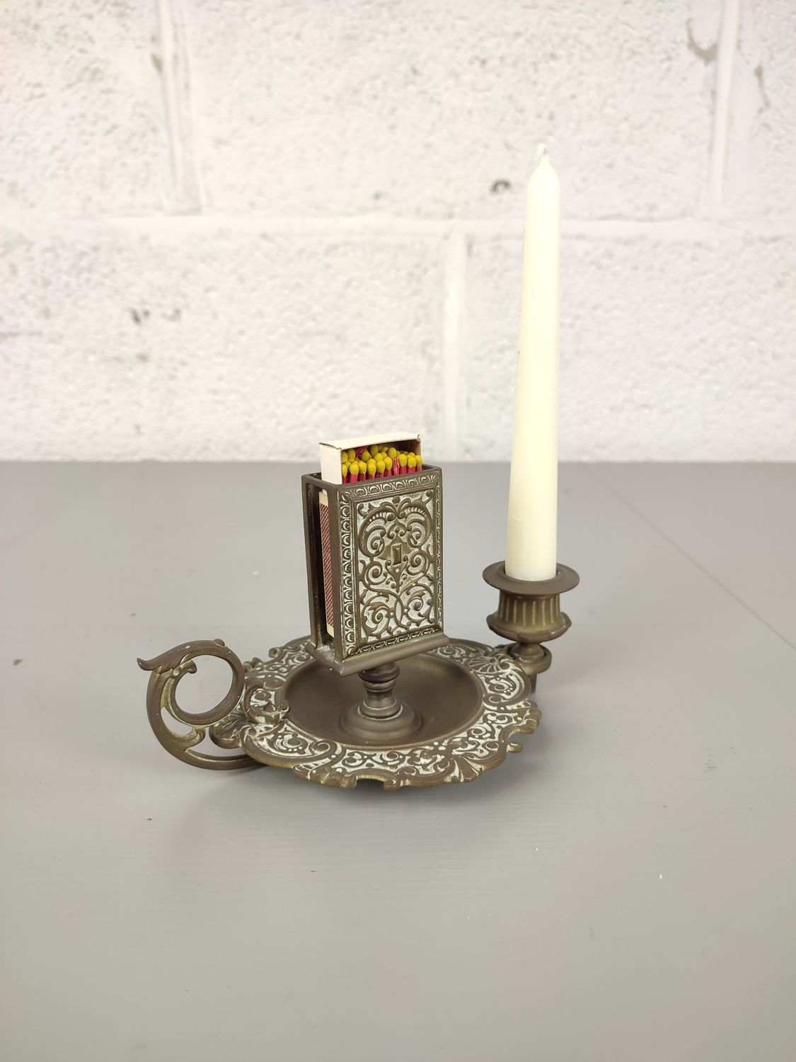 Antique candle holder with matches holder