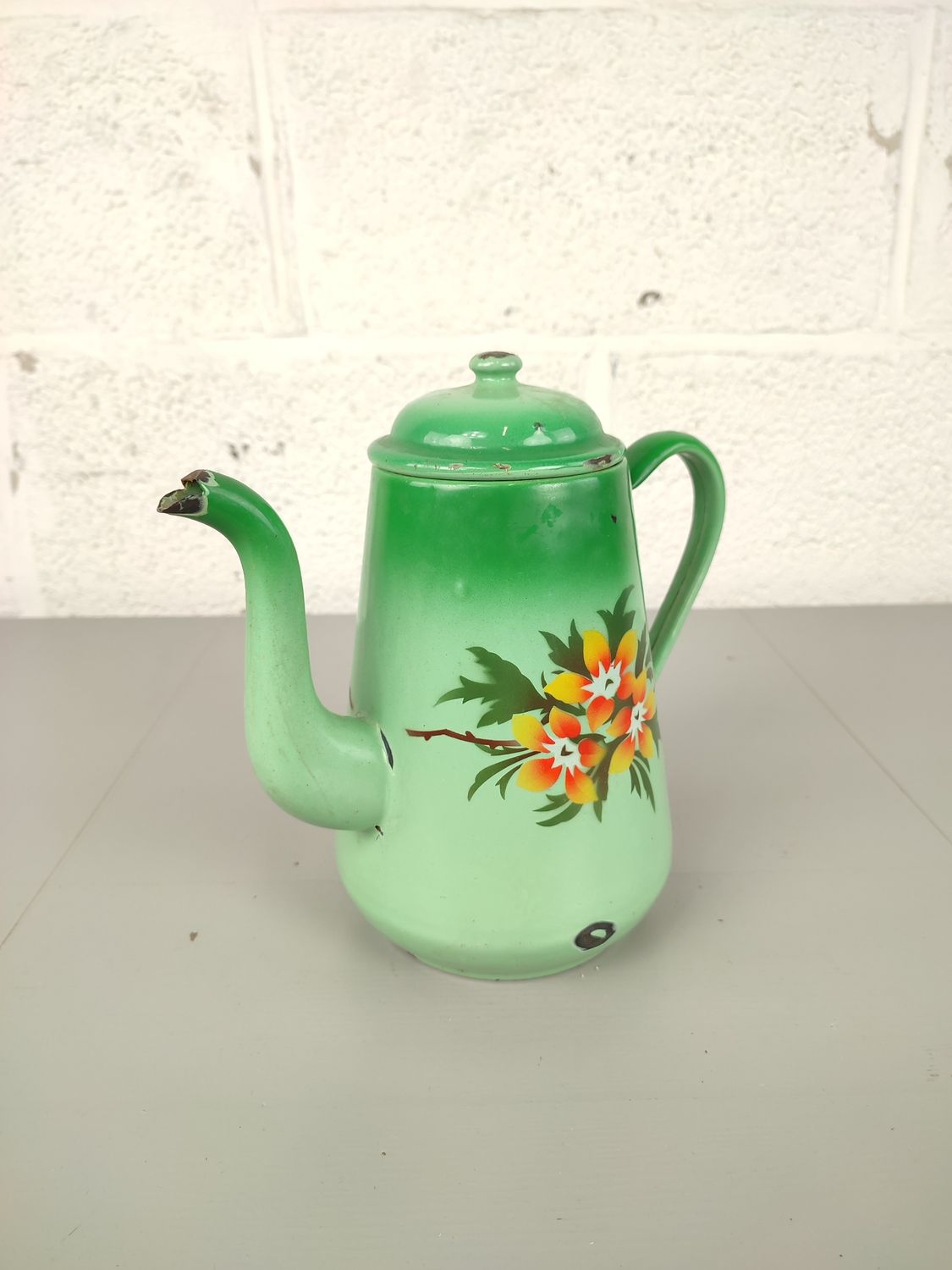 Antique enamel tea pot with flowers