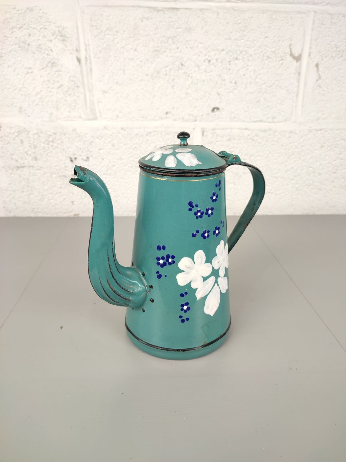 Antique enamel tea pot with flowers