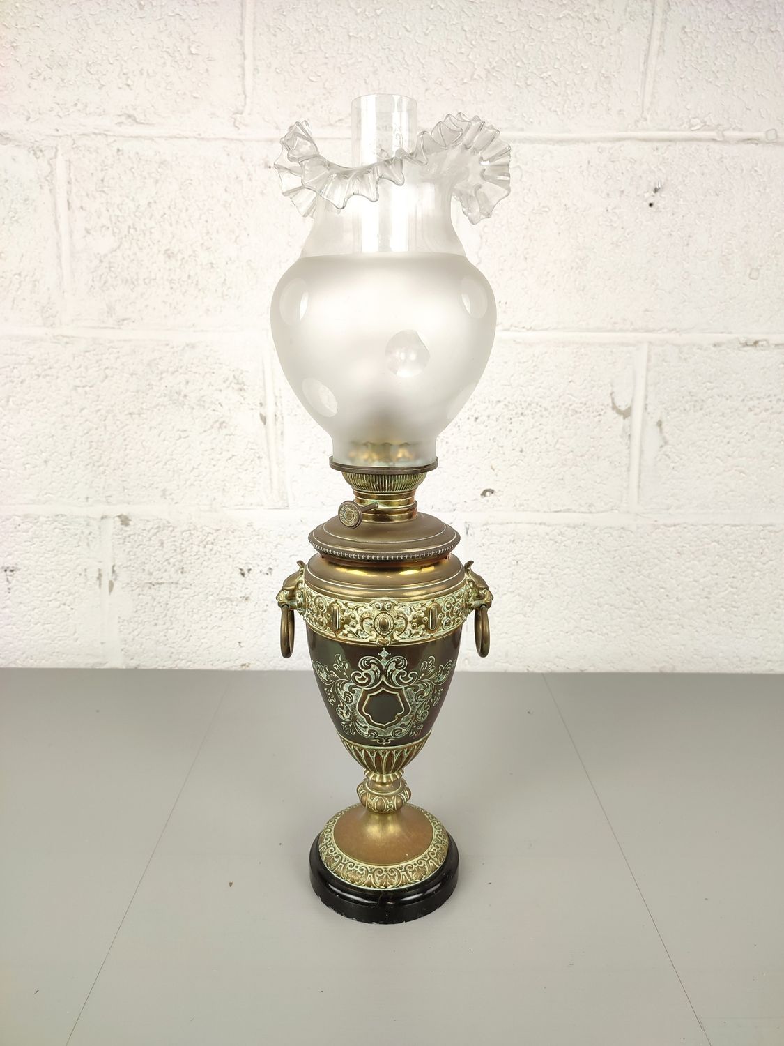 Antique brass oil lamp on marble base