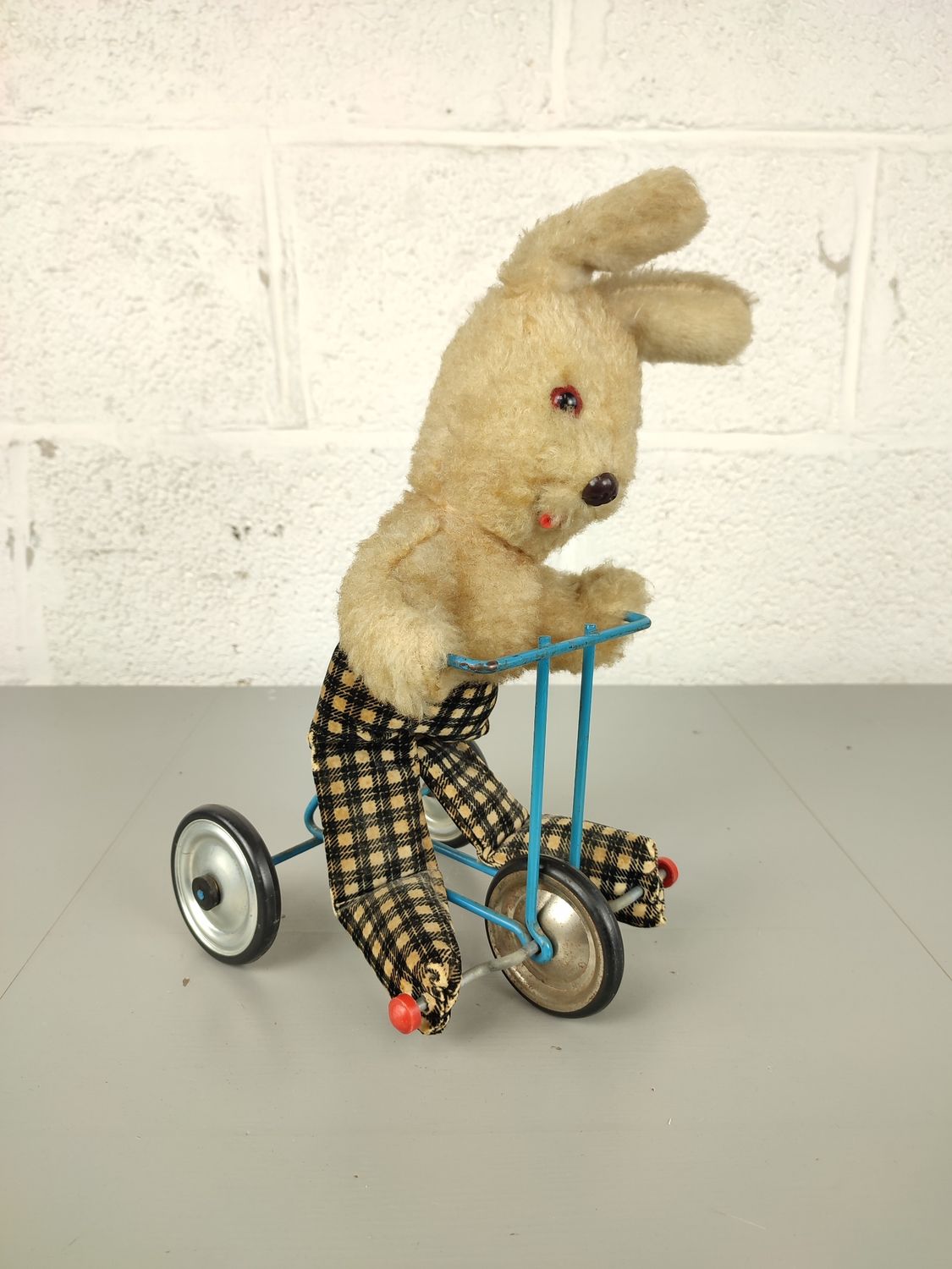 Old bunny on tricycle by Pintel