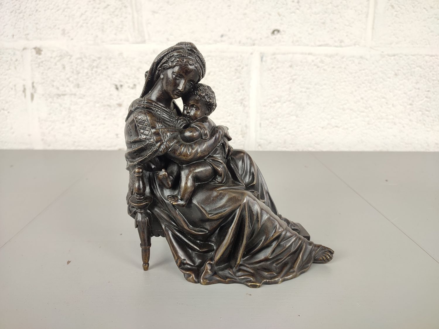 Bronze statue madonna with child