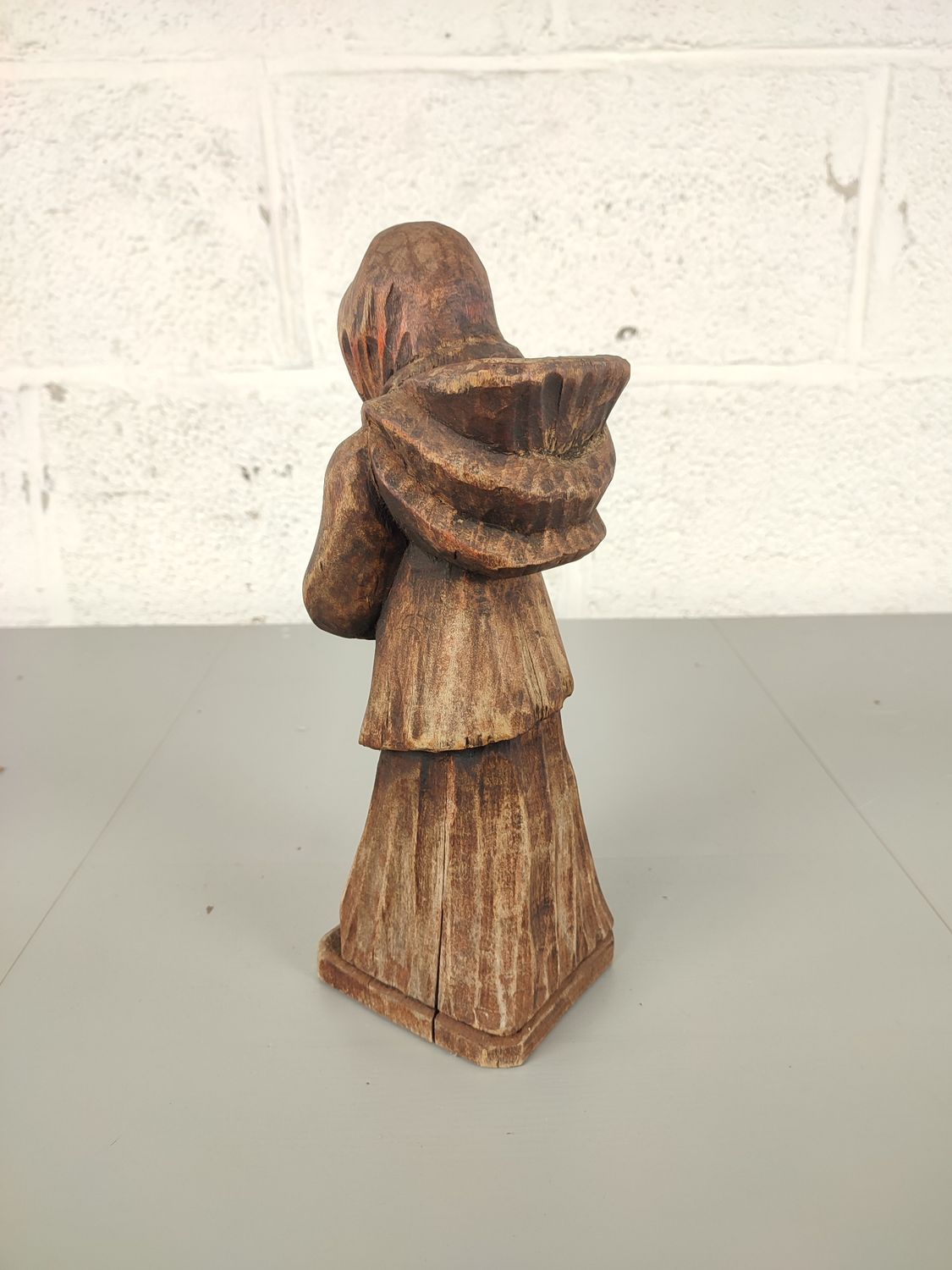 Wooden statue of an old lady