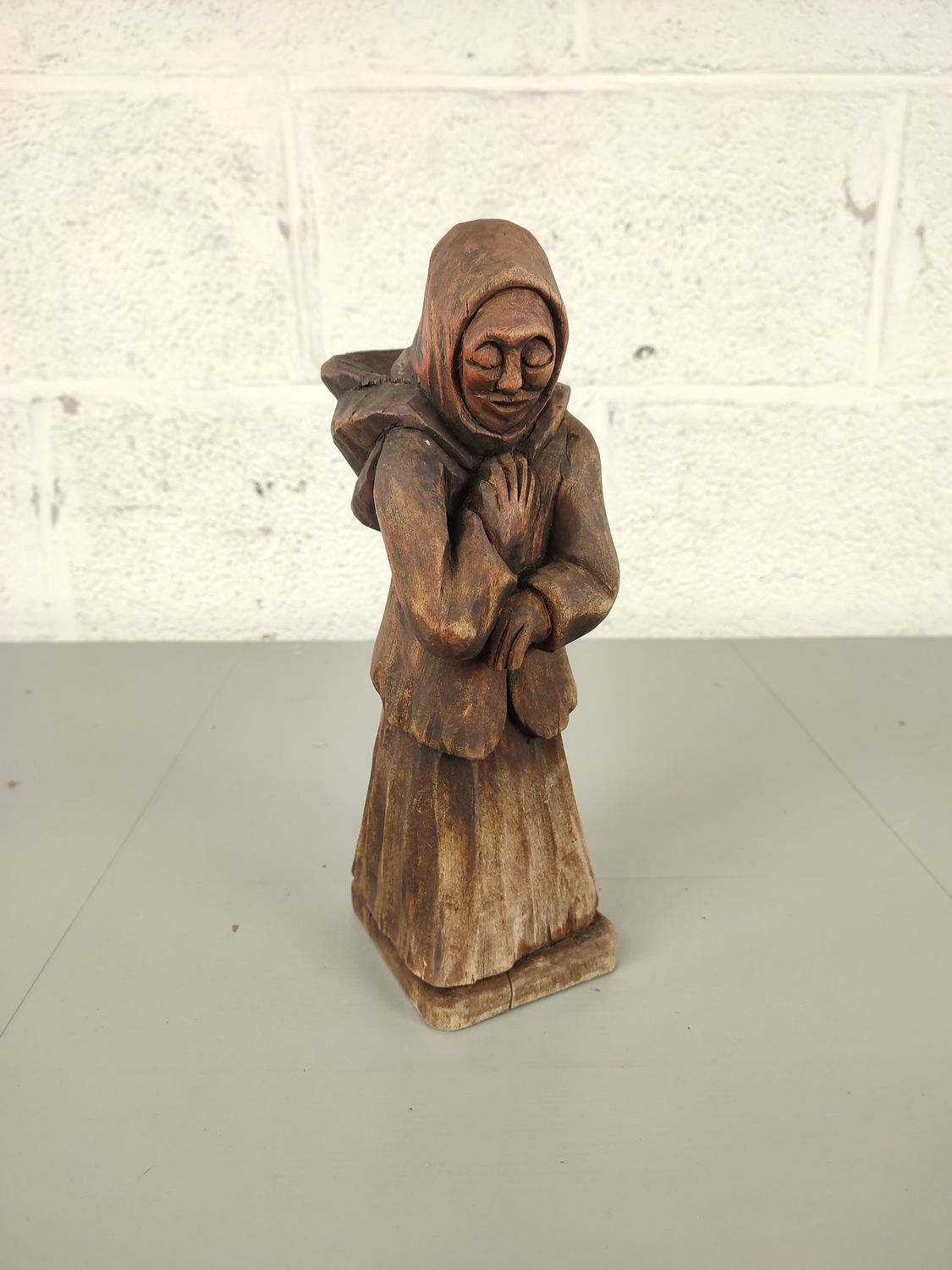 Wooden statue of an old lady