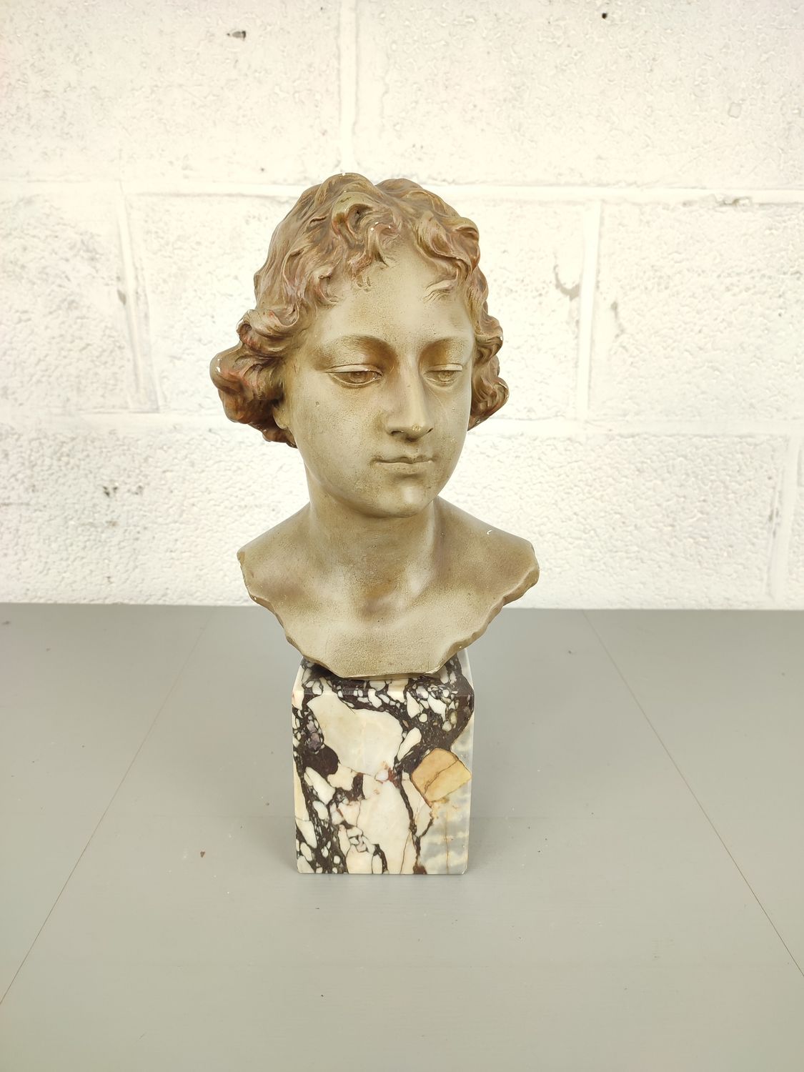 Bust on marble base, C. Melotti