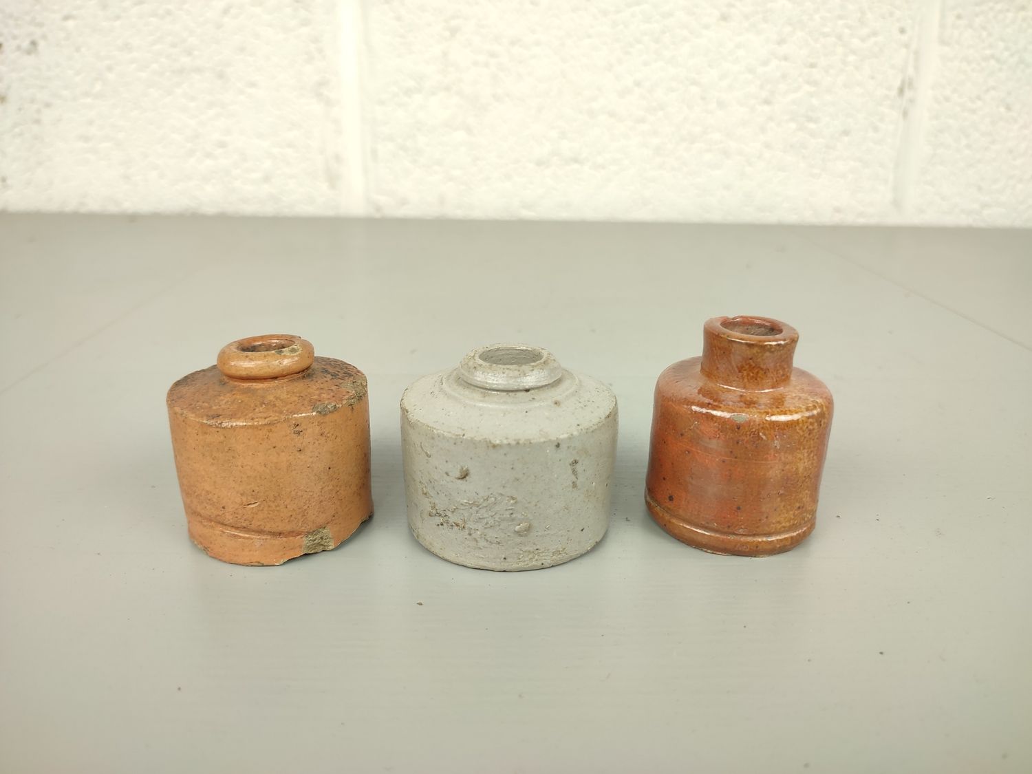 3 small ink bottles