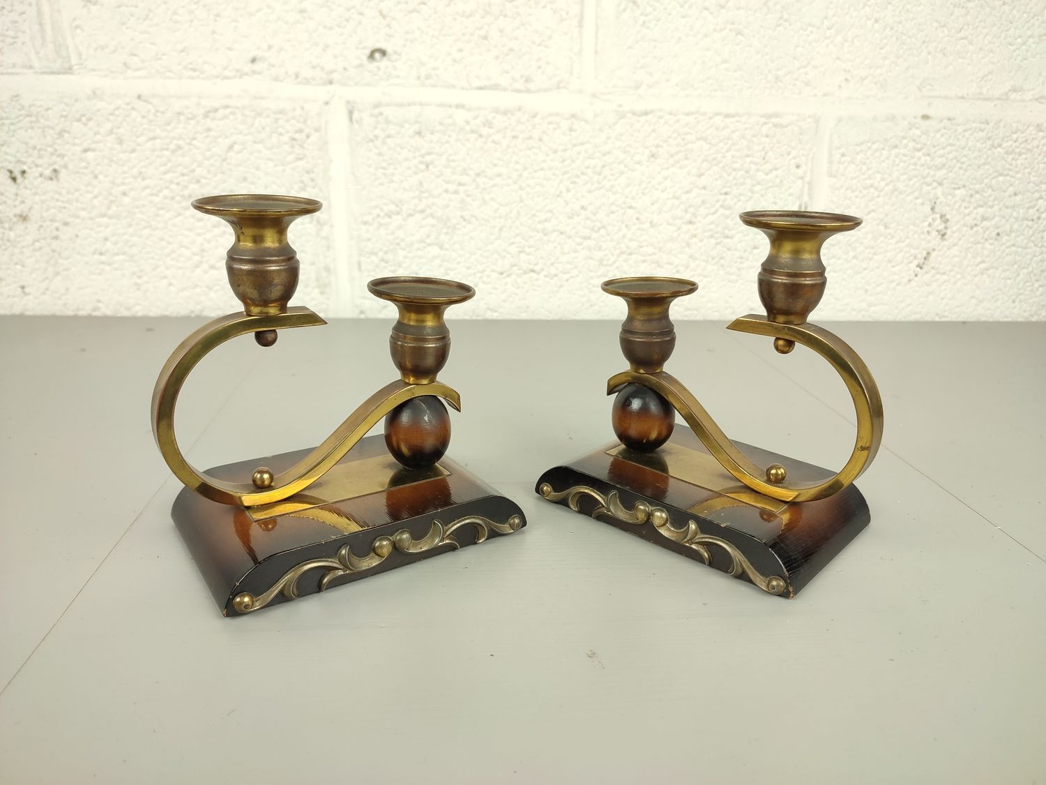 Pair of art deco candlesticks in brass &amp; wood.
