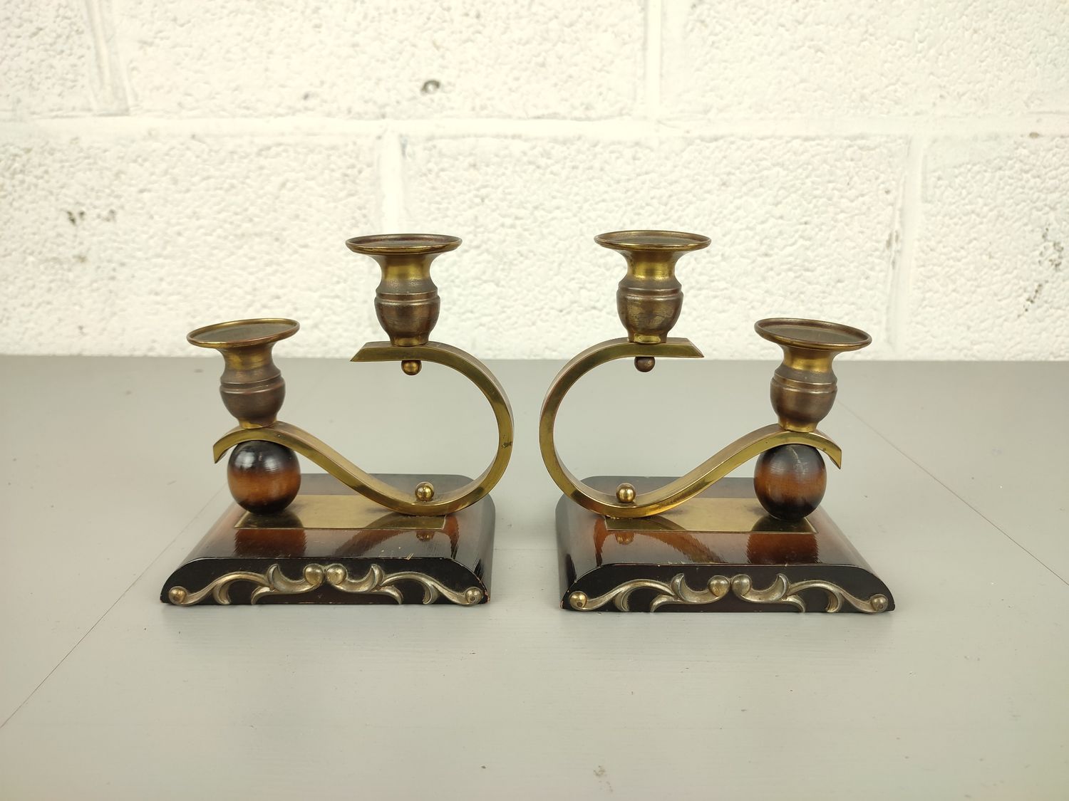 Pair of art deco candlesticks in brass &amp; wood.