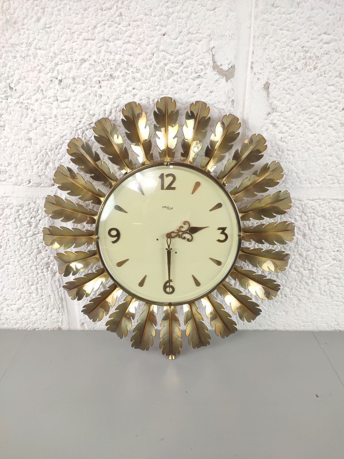 Vintage brass sun clock
