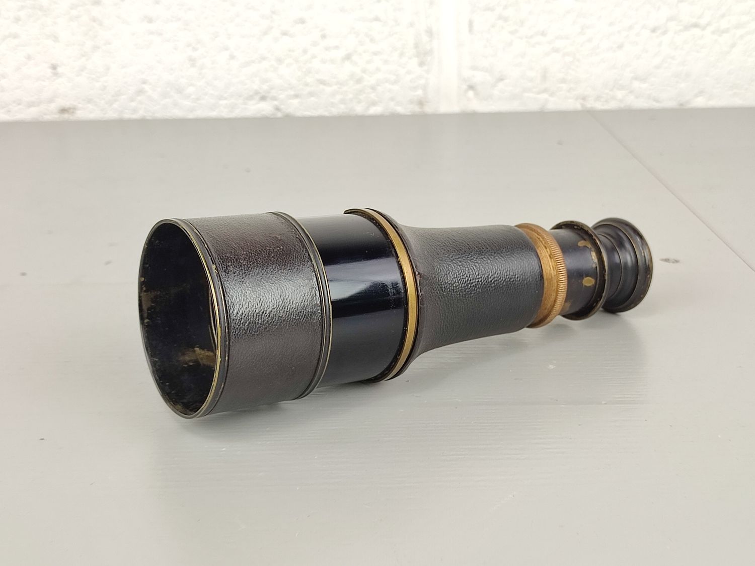 Small antique monocular